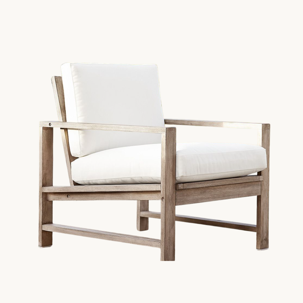 Wooden armchair with white cushions and a white backrest, on a plain white background.