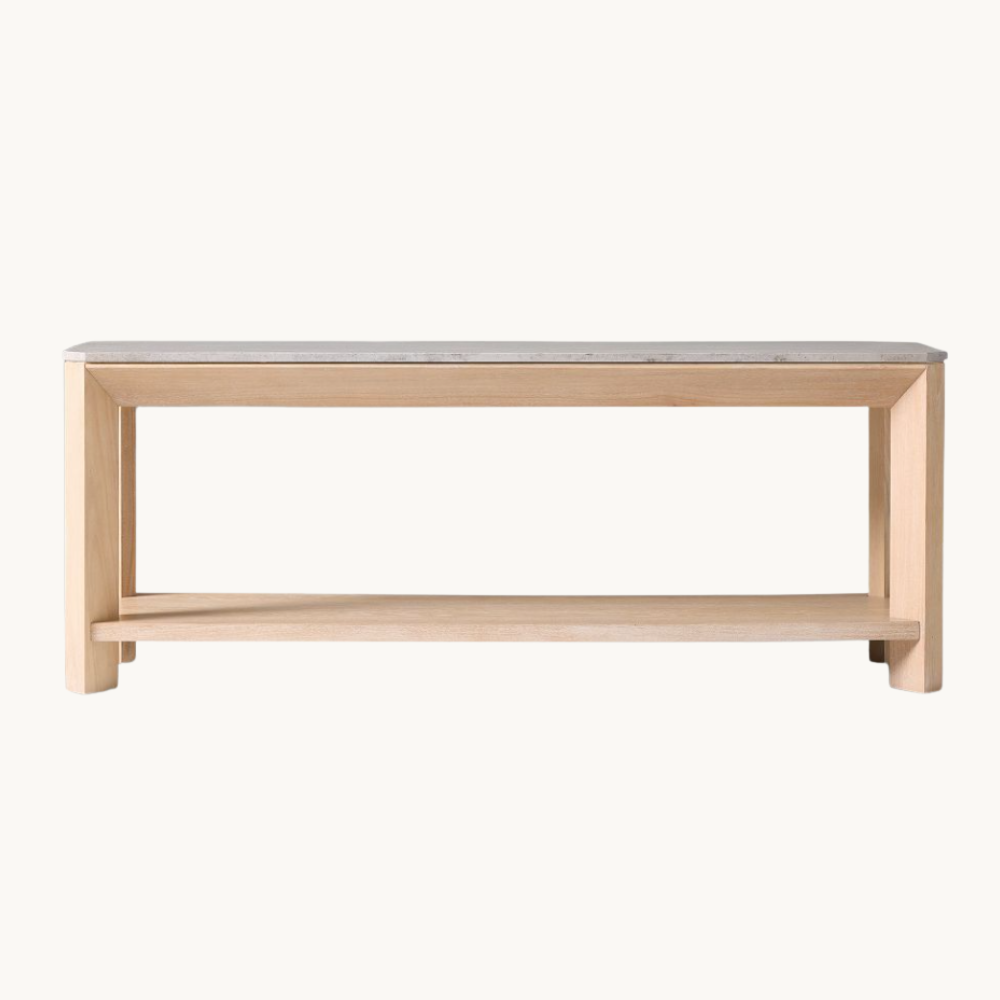 A minimalist wooden bench with a flat surface and an open lower shelf, light-colored wood, against a plain white background.