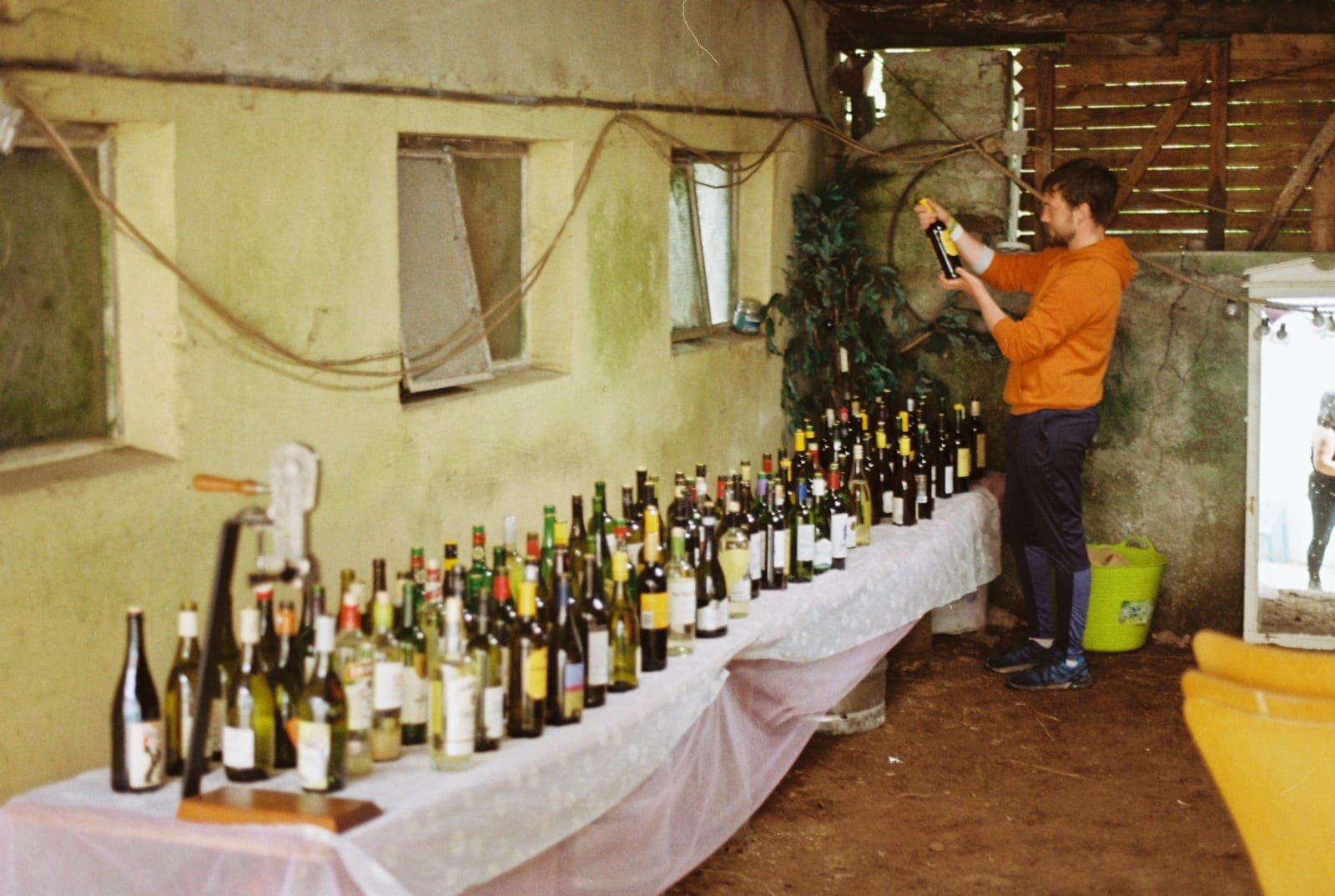 The bartender at our wedding (a friend of ours) examining one of the bottles of wine we made