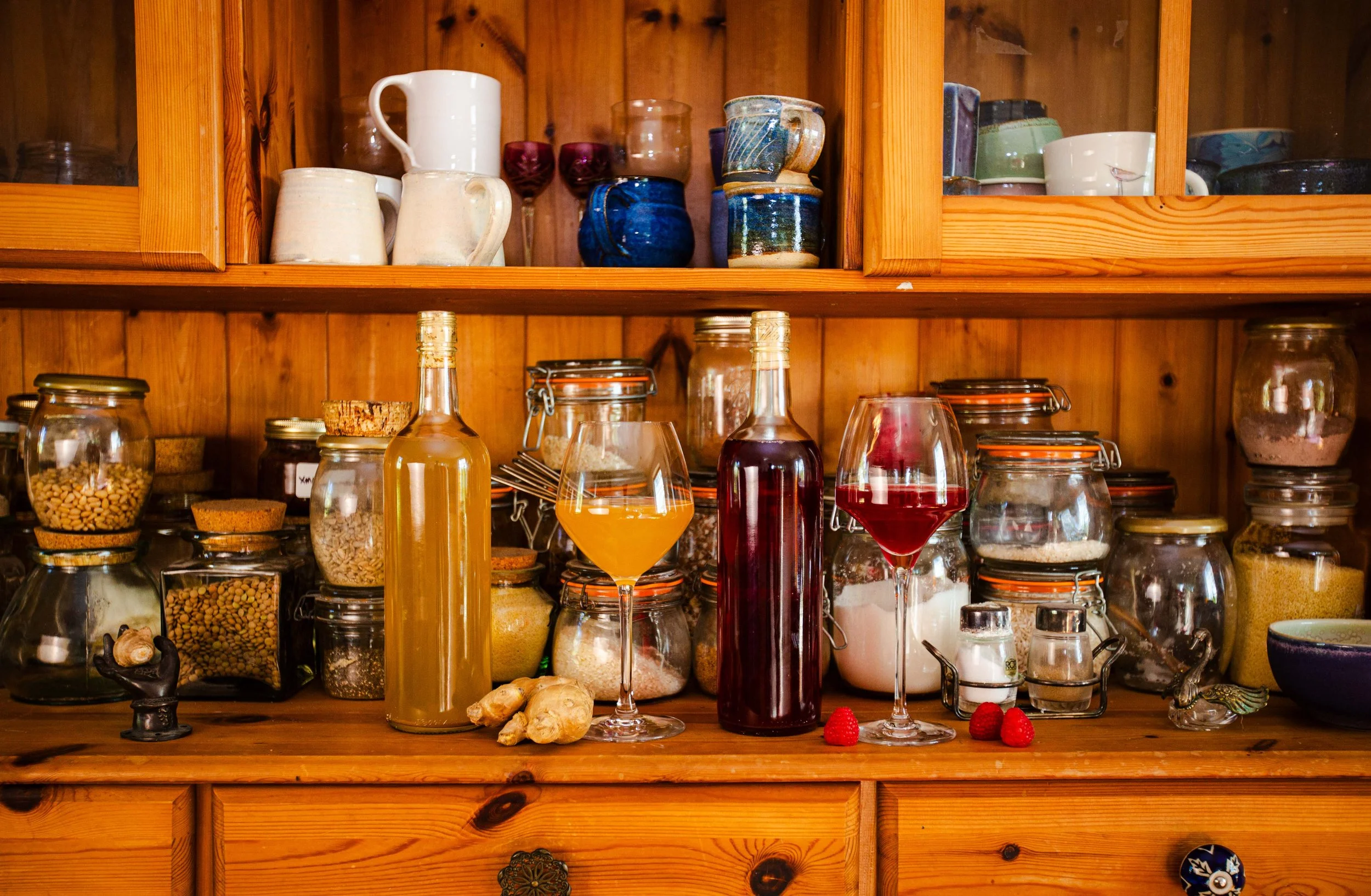 Ginger Wine and Raspberry Wine sit on a spice shelf