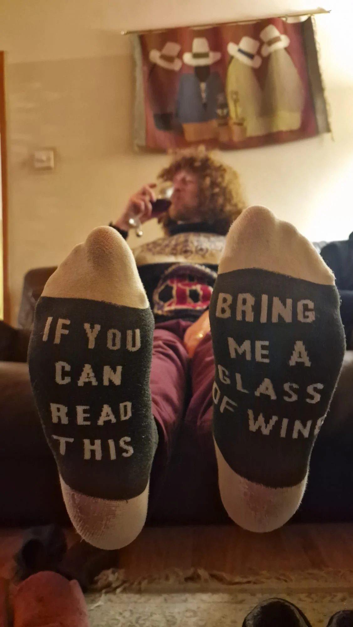 Socks that say 'if you can read this, bring me a glass of wine'