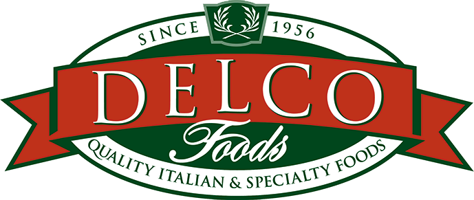 Logo of Delco Foods featuring a green, red, and white color scheme, with text indicating it was established in 1956 and specializes in Italian and specialty foods.