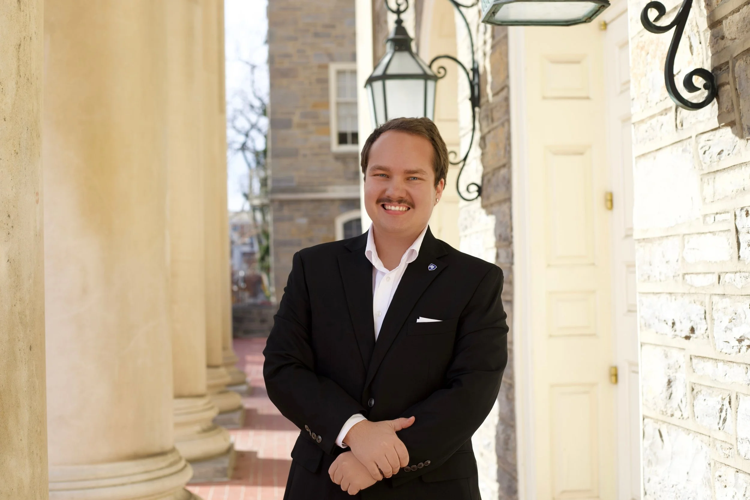 Ryan Greathouse standing outside Old Main on the Penn State campus.