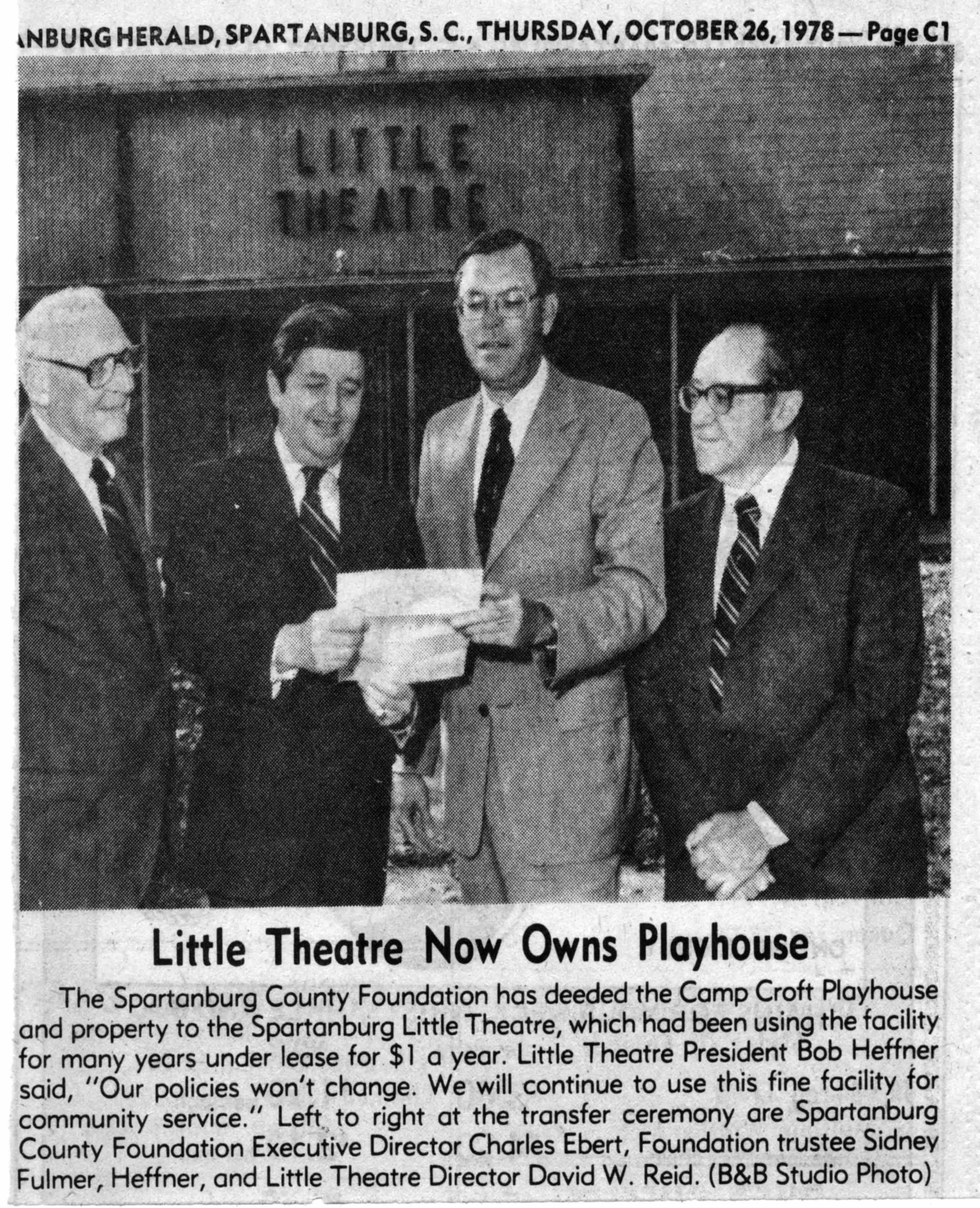 Black and white newspaper clipping from the Spartanburg Herald, dated October 26, 1978. The photo shows four men standing in front of a sign that reads 'Little Theatre.' The caption mentions that the Spartanburg County Foundation has deeded the Camp Croft Playhouse property to the Spartanburg Little Theatre.