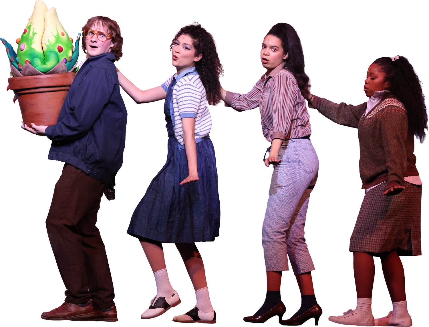 Four young women lined up, standing side by side, holding onto each other with one hand each, and facing to the right. The first person is holding a large potted succulent cactus plant. They are dressed in casual vintage-style clothing.