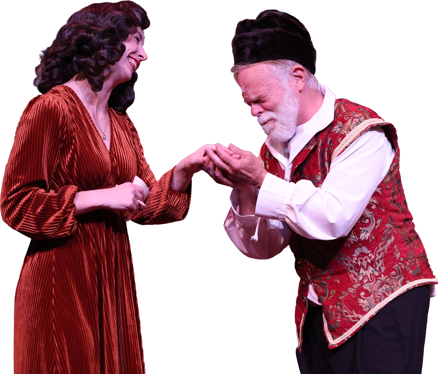 A woman in a red, velvet dress smiling and holding hands with a man in historical costume, who is kneeling and holding her hand in a gesture of reverence or proposal.