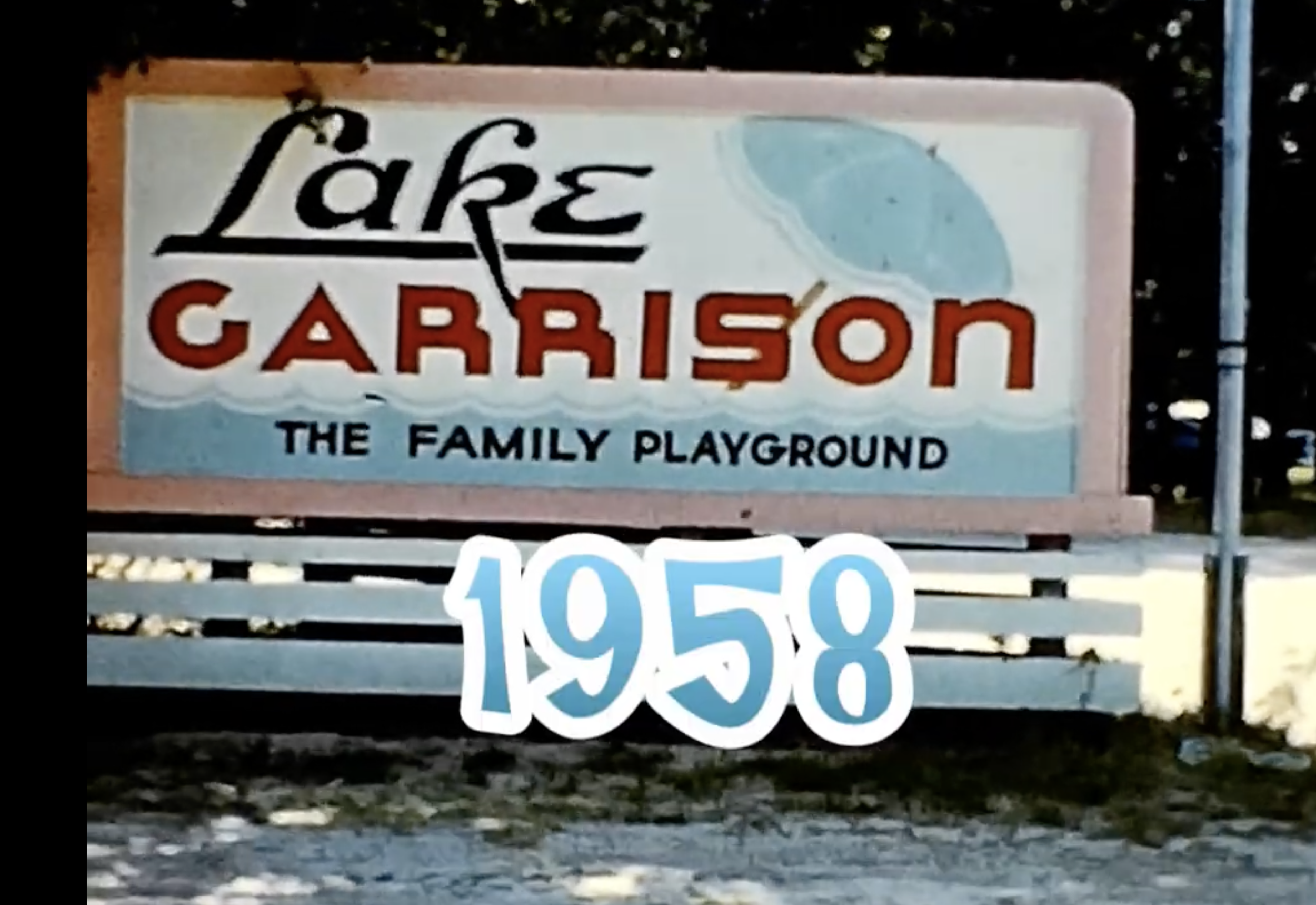 Sign for Lake Garrison, labeled as the family playground, dated 1958.