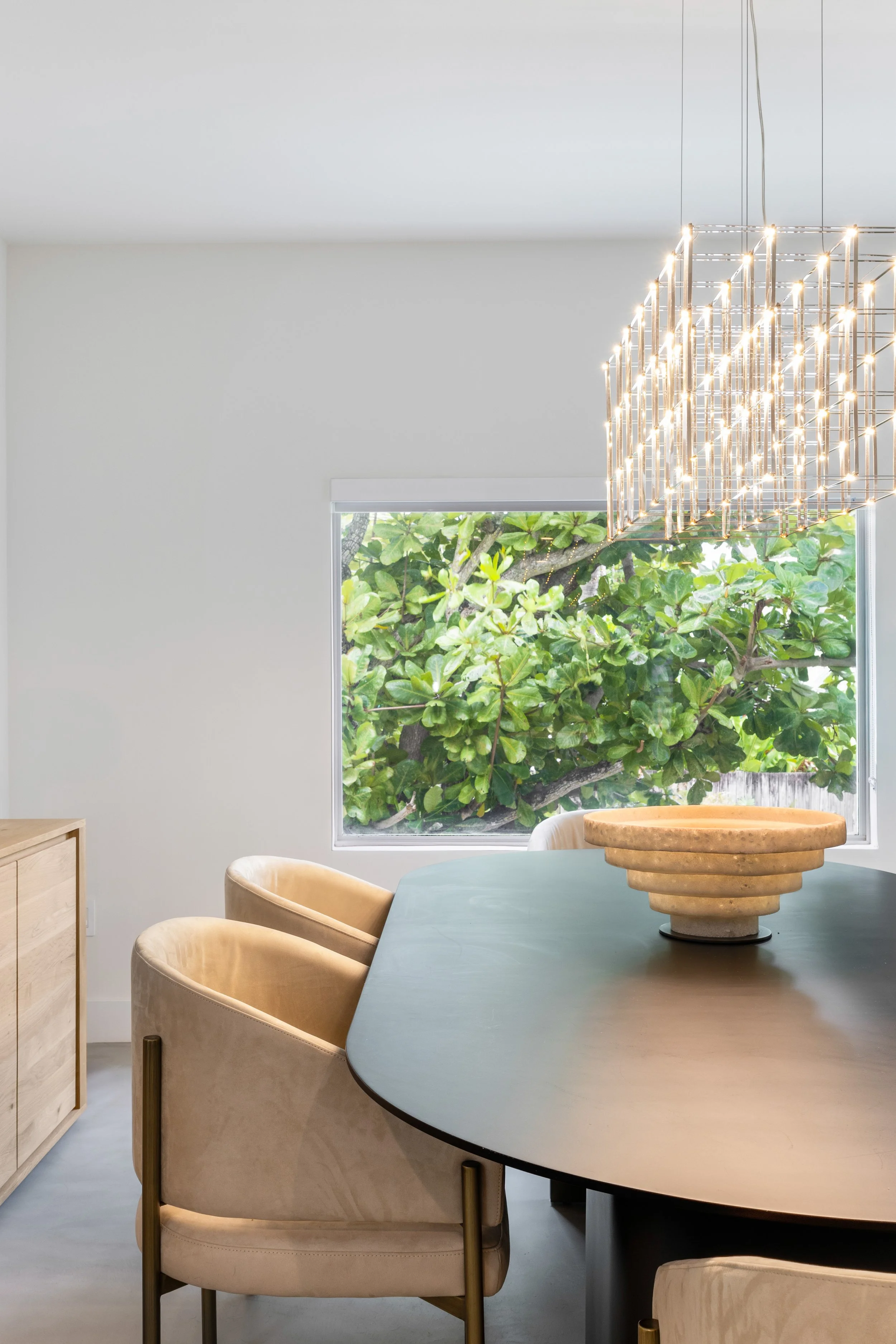 Detail shot of dining room with chandelier  - Modernized Brutalist Architecture - Coconut Grove - CURATED. Studio