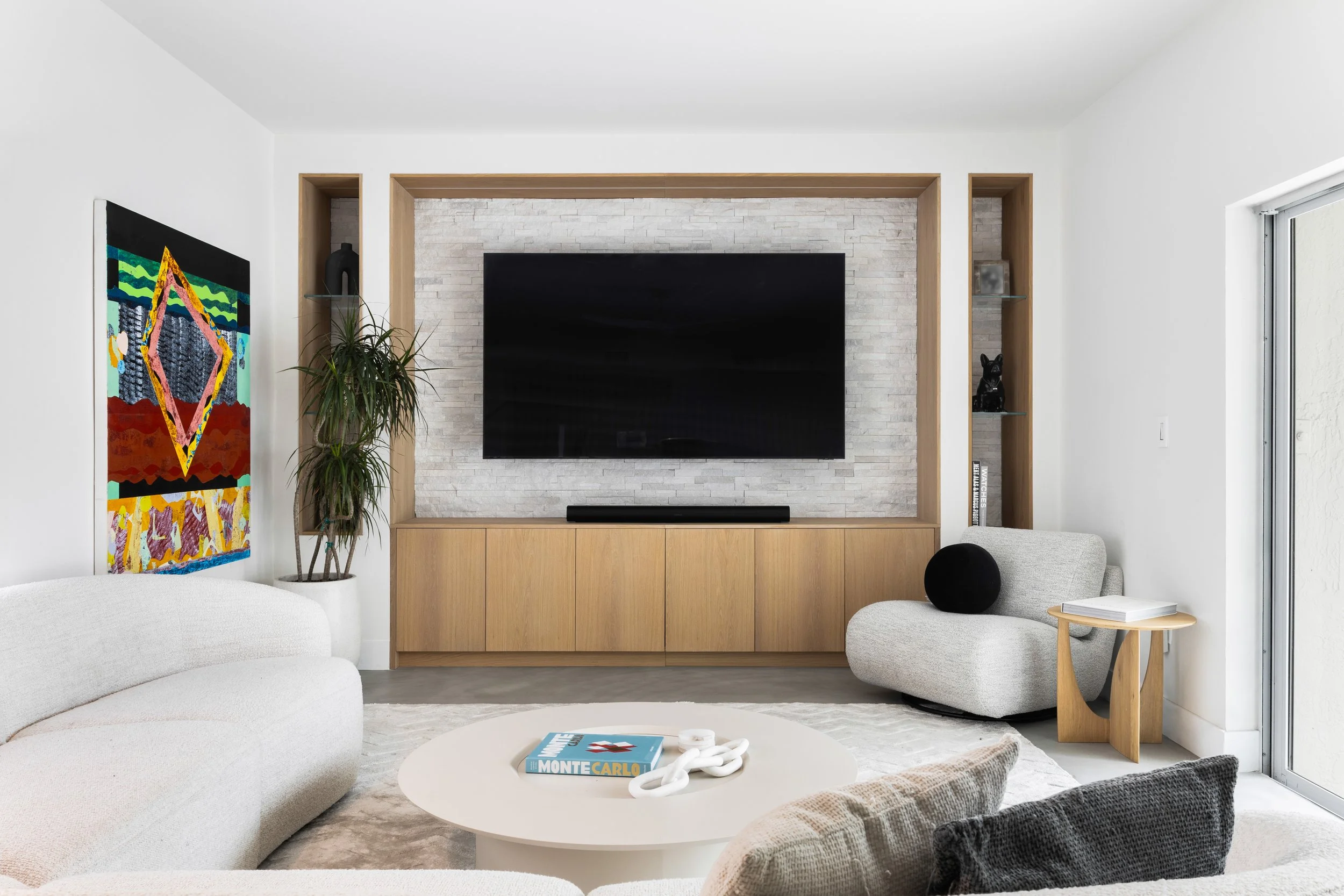 Family room with built in tv millwork - Modernized Brutalist Architecture - Coconut Grove - CURATED. Studio