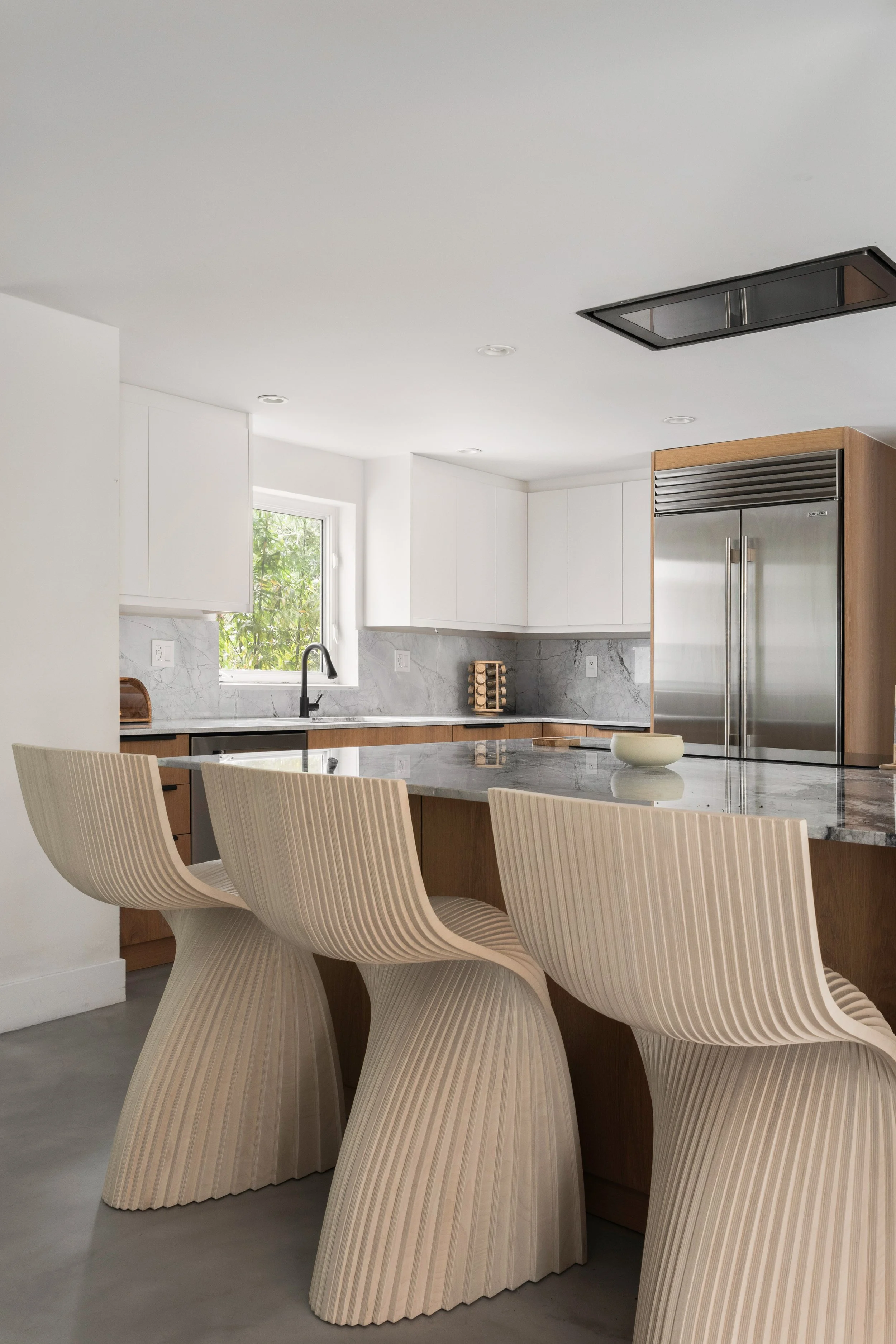 Modern kitchen with sculptural counter stools - Modernized Brutalist Architecture - Coconut Grove - CURATED. Studio