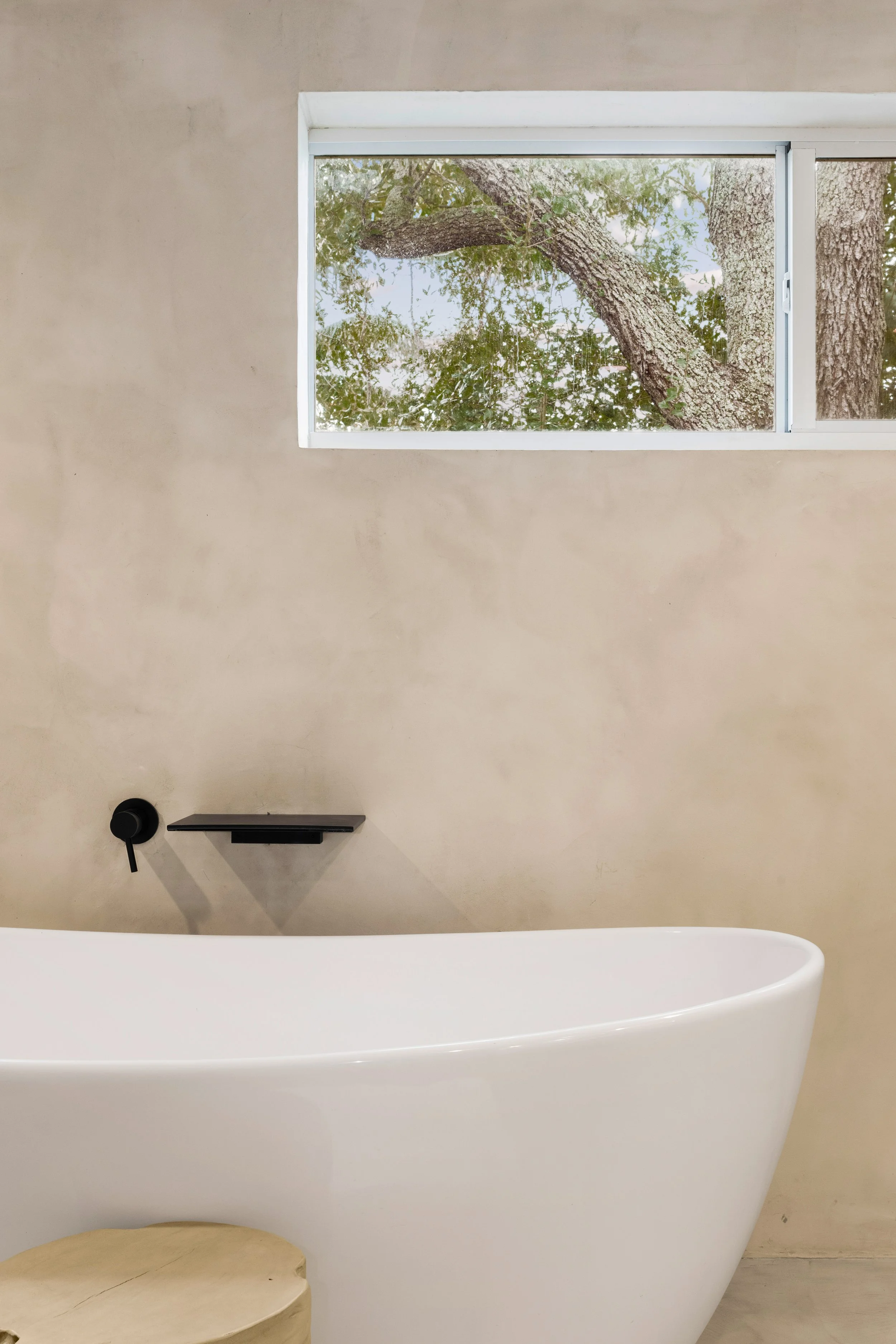 Modern primary bathroom with micro-cement textured walls - Modernized Brutalist Architecture - Coconut Grove - CURATED. Studio
