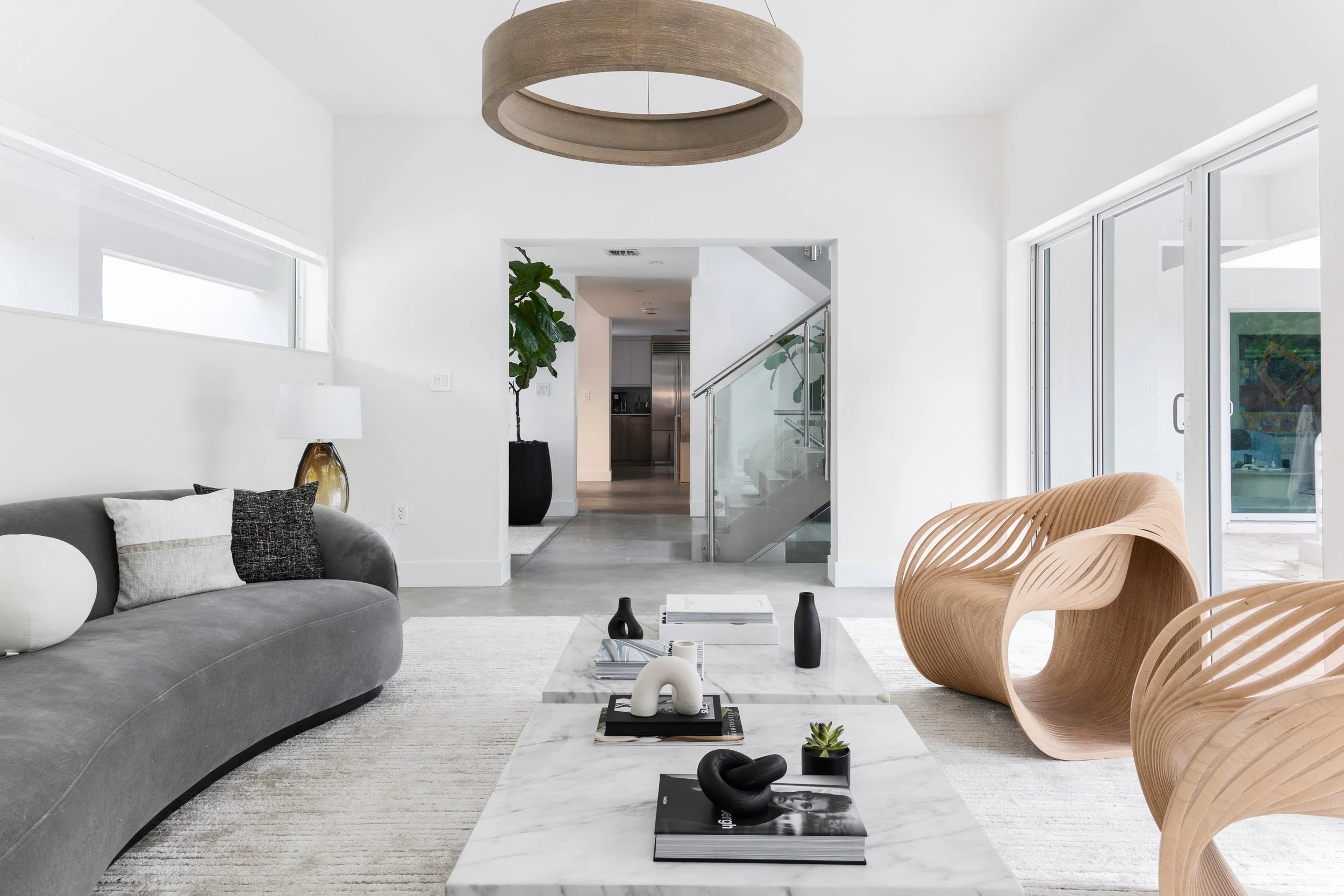 Modern space with sculptural accent chairs - Modernized Brutalist Architecture - Coconut Grove - CURATED. Studio