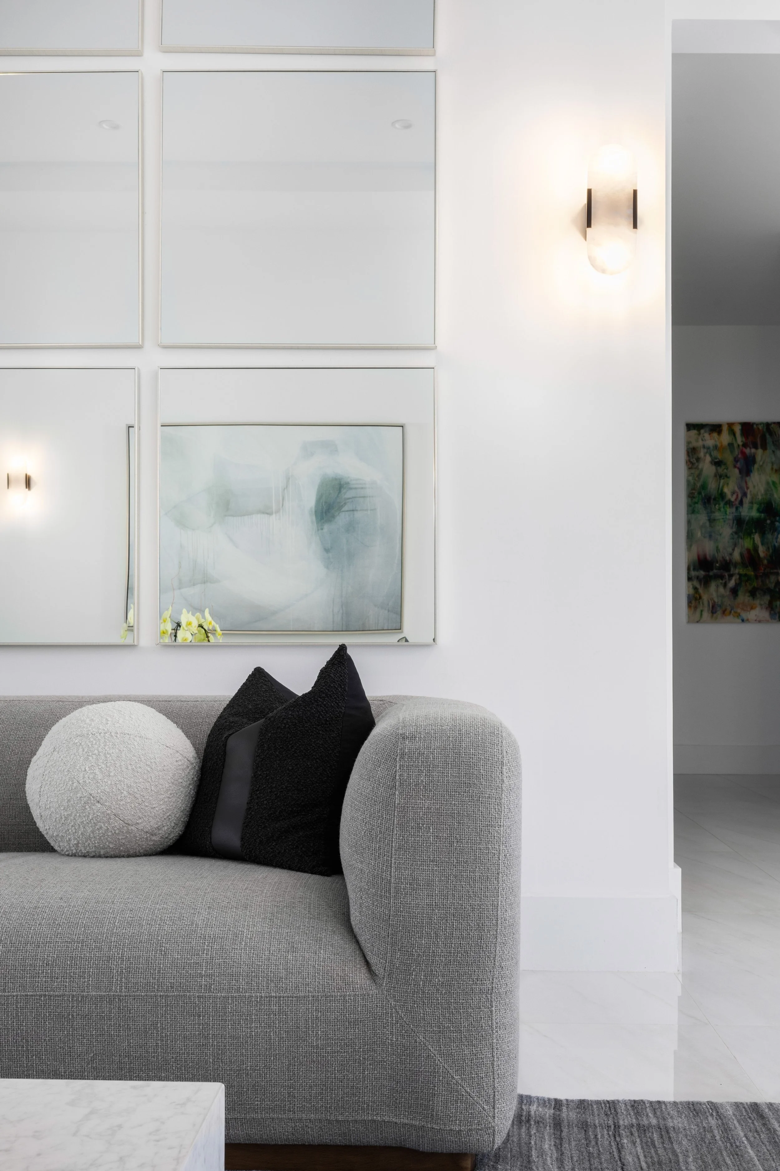Detail shot of living room with mirror wall - Modern Family Estate - Pinecrest - CURATED. Studio