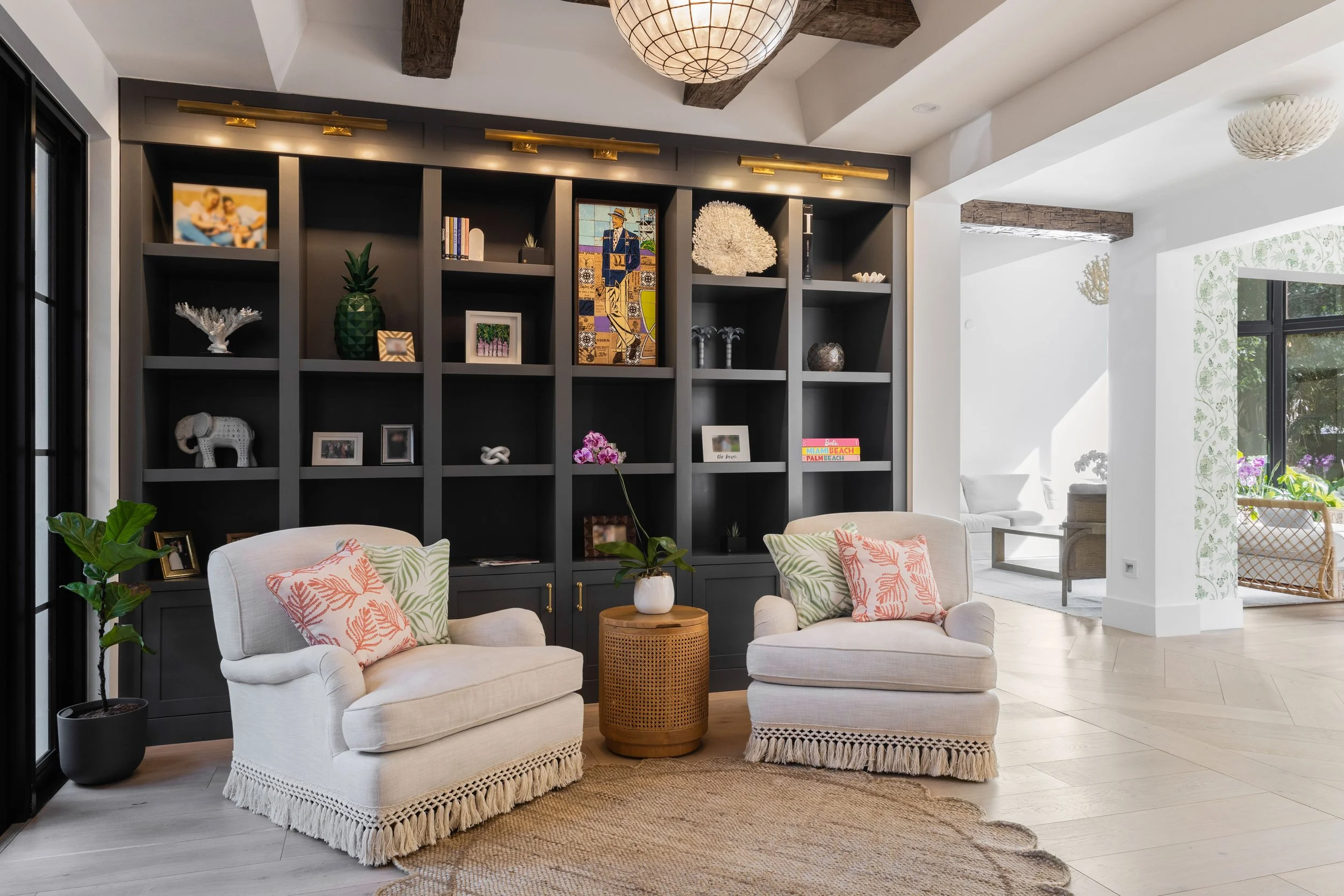 Seating area, with black bookshelf - Coastal Boho Estate - Coconut Grove - CURATED. Studio