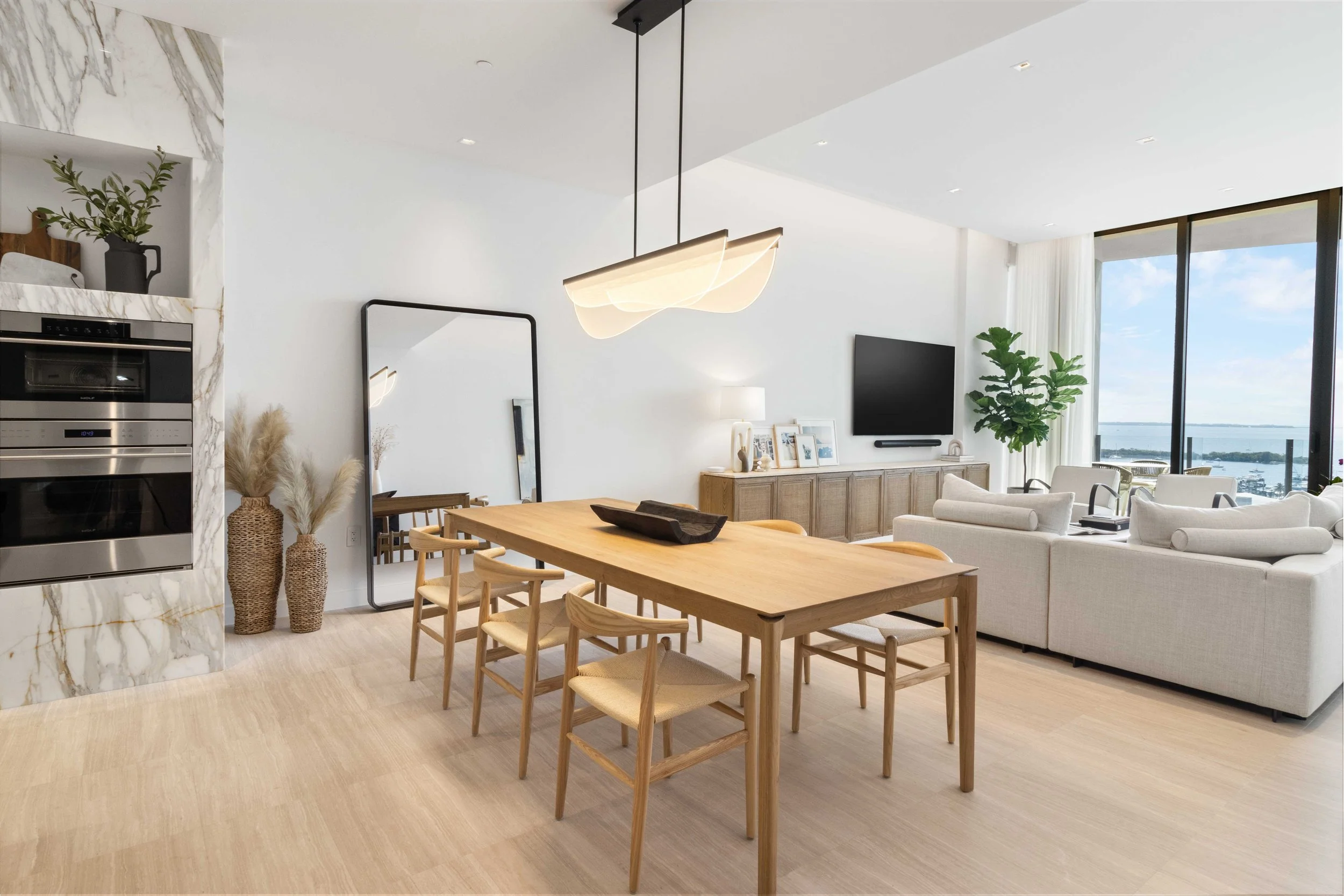 Modern open concept living and dining space - Park Grove Condo - Coastal Contemporary Design - CURATED. Studio