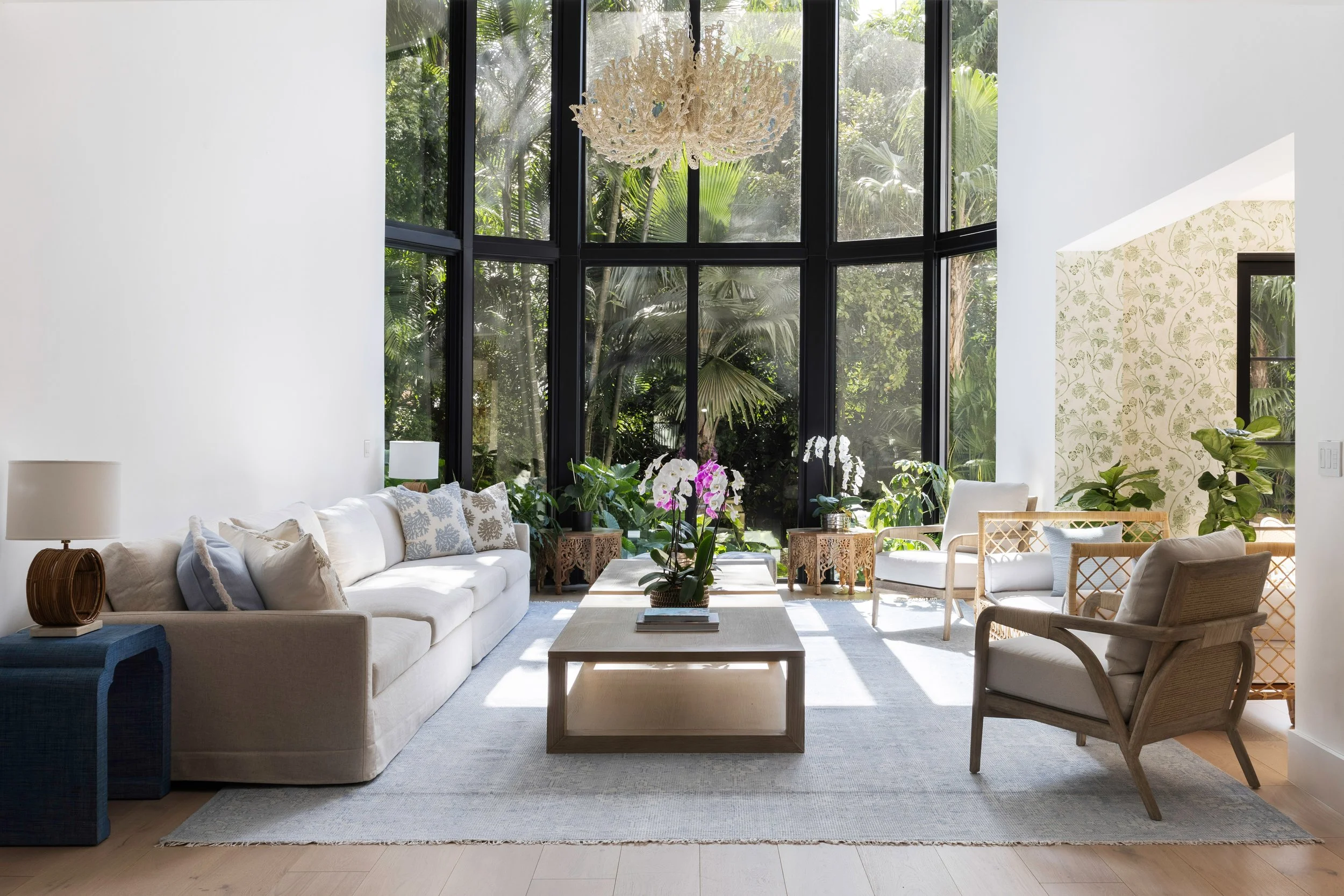 Living room with coastal pieces and black framed windows - Coastal Boho Estate - Coconut Grove - CURATED. Studio
