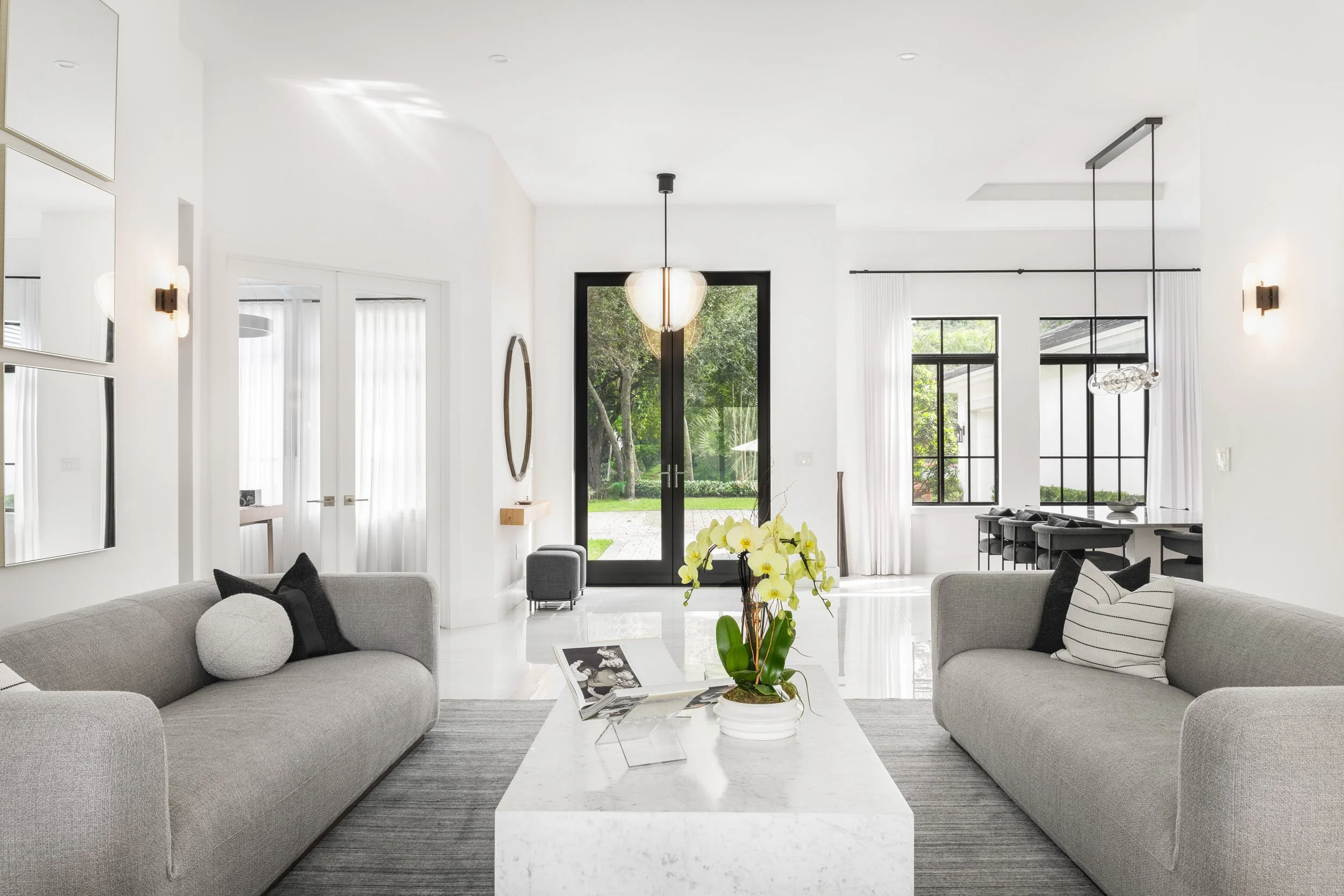 Contemporary living space overlooking entry - Modern Family Estate - Pinecrest - CURATED. Studio