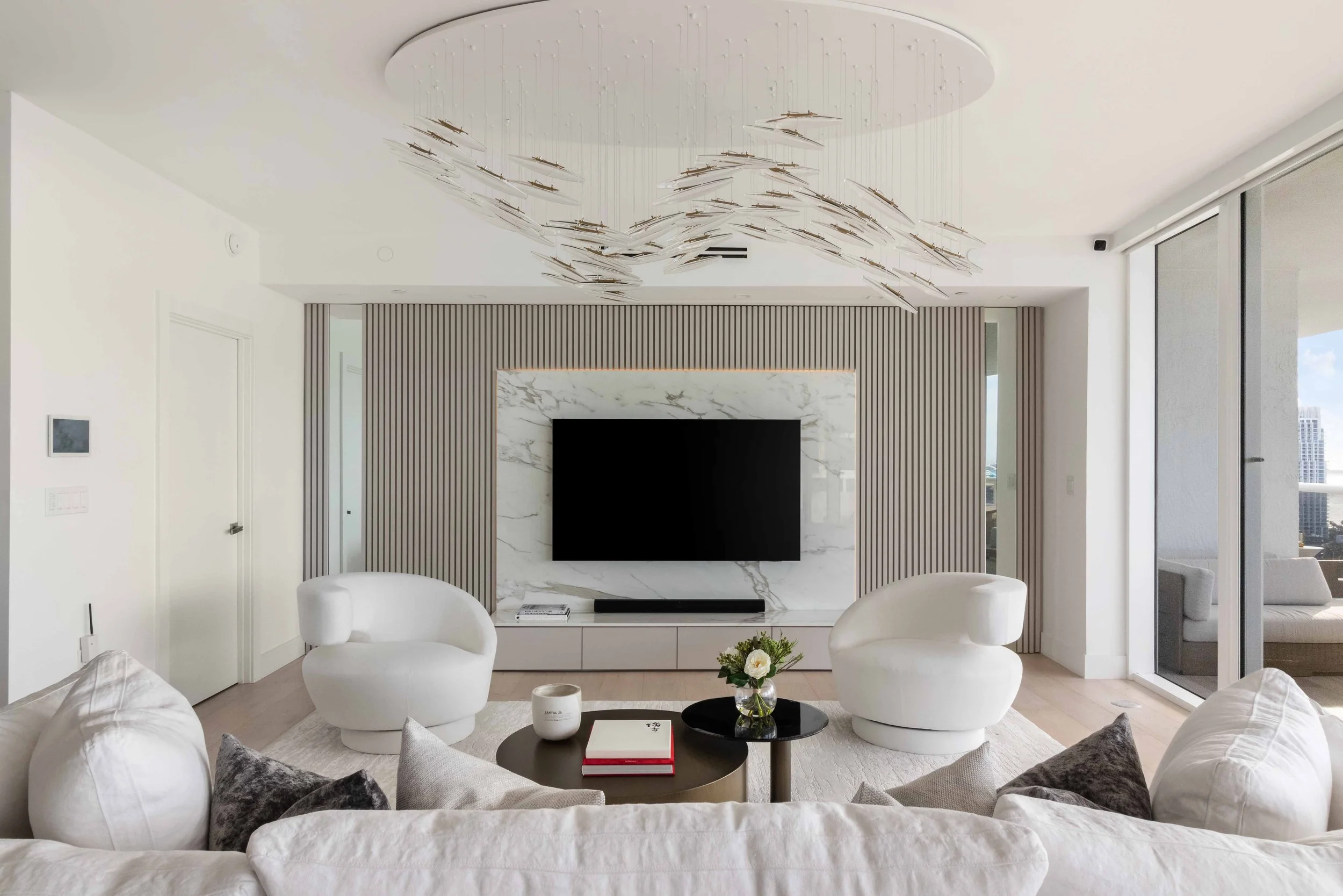 Modern living room with hidden doorway - Murano Grande - South of Fifth Design - CURATED. Studio