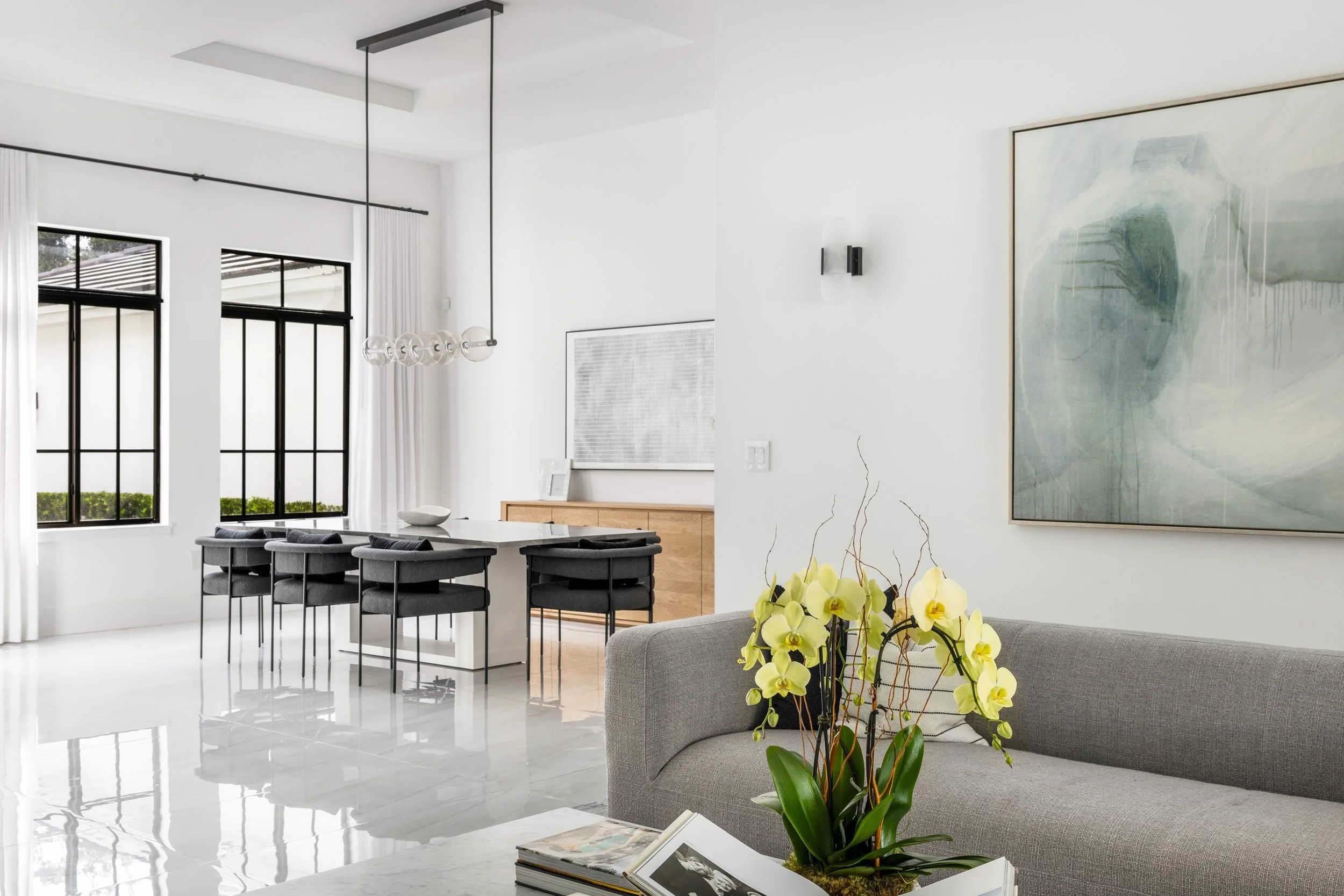 Contemporary living space overlooking dining area - Modern Family Estate - Pinecrest - CURATED. Studio