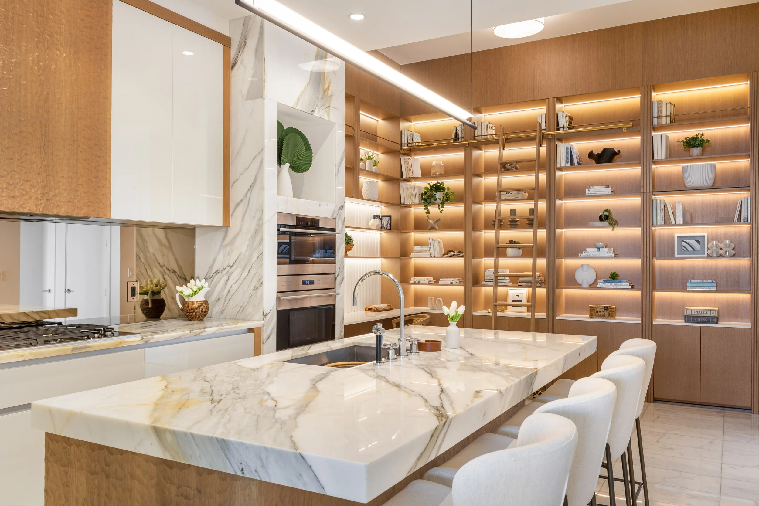 Kitchen Island overlooking custom bookshelf built in space - Two Park Grove - Parisian Inspired Design - CURATED. Studio