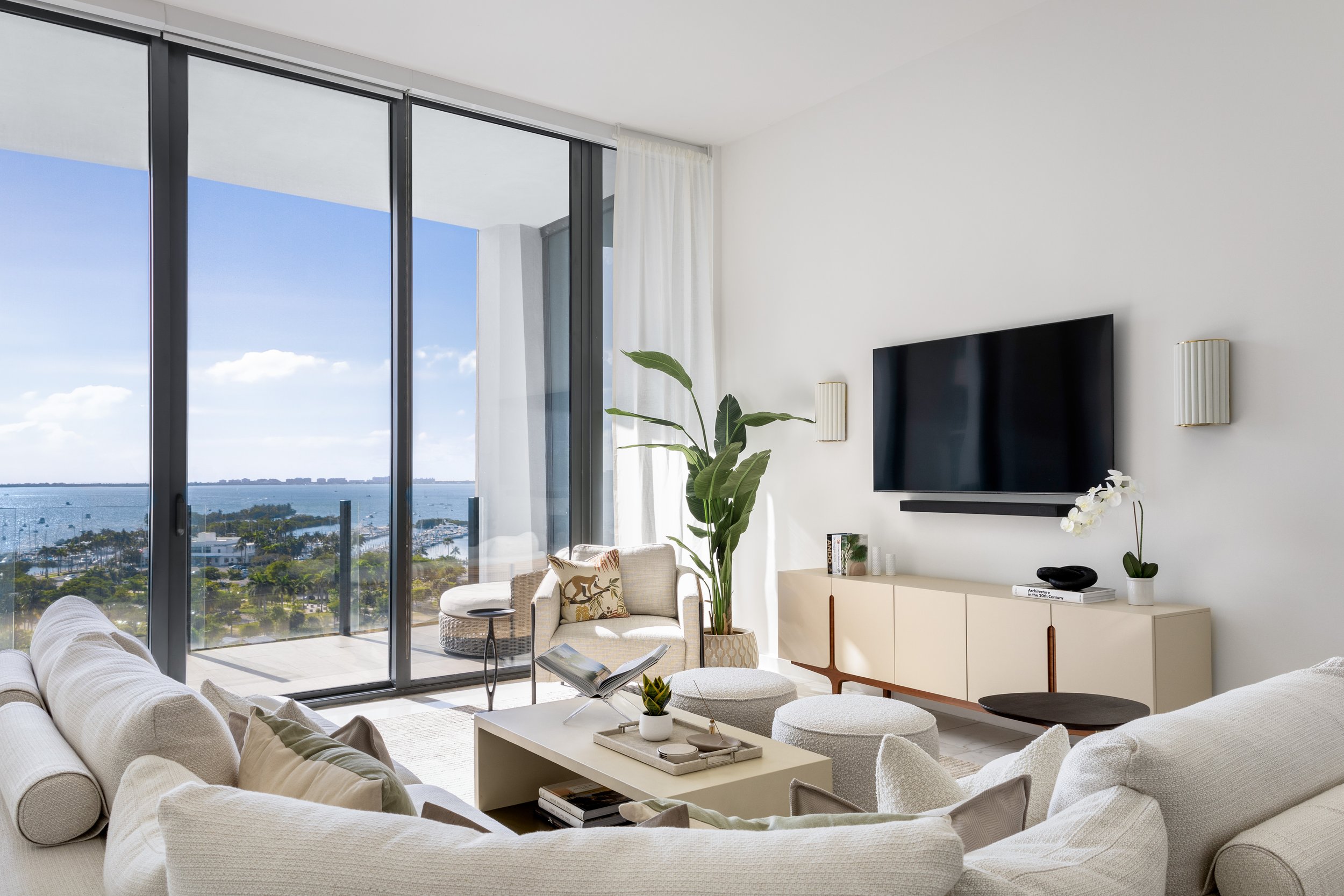 Modern living room overlooking Biscayne Bay - Two Park Grove - Parisian Inspired Design - CURATED. Studio