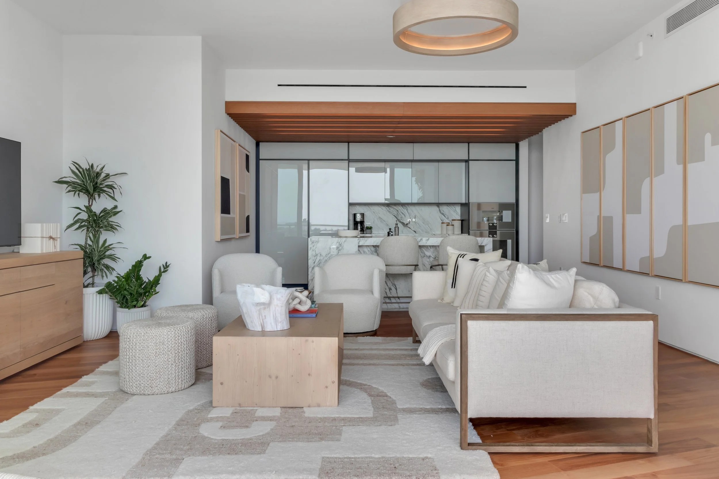 Living and kitchen space with coastal accents - Monad Terrace - "New Miami" Coastal Design - CURATED. Studio