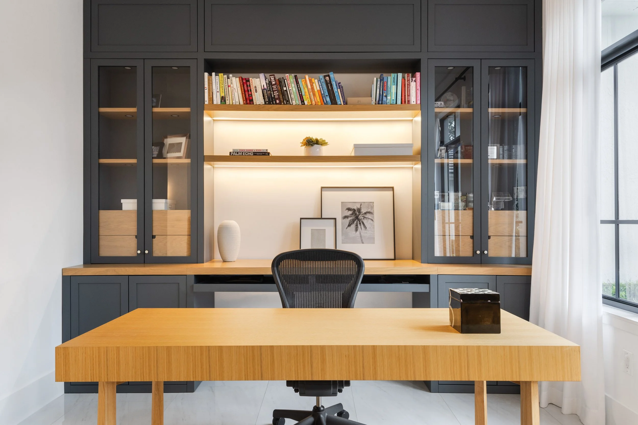 A modern home office with darker accent built ins - Modern Family Estate - Pinecrest - CURATED. Studio