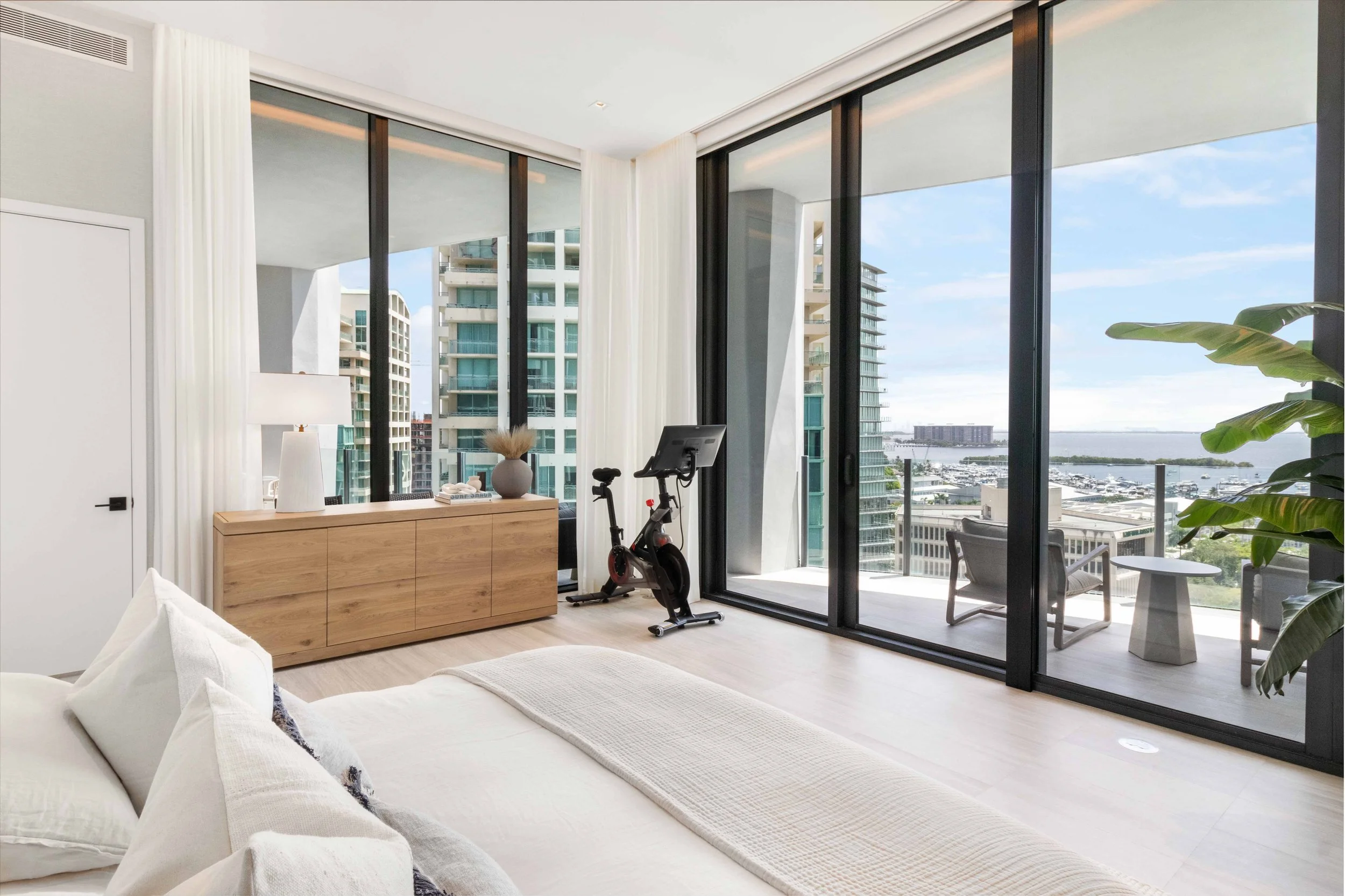 Primary bedroom overlooking Coconut Grove - Park Grove Condo - Coastal Contemporary Design - CURATED. Studio