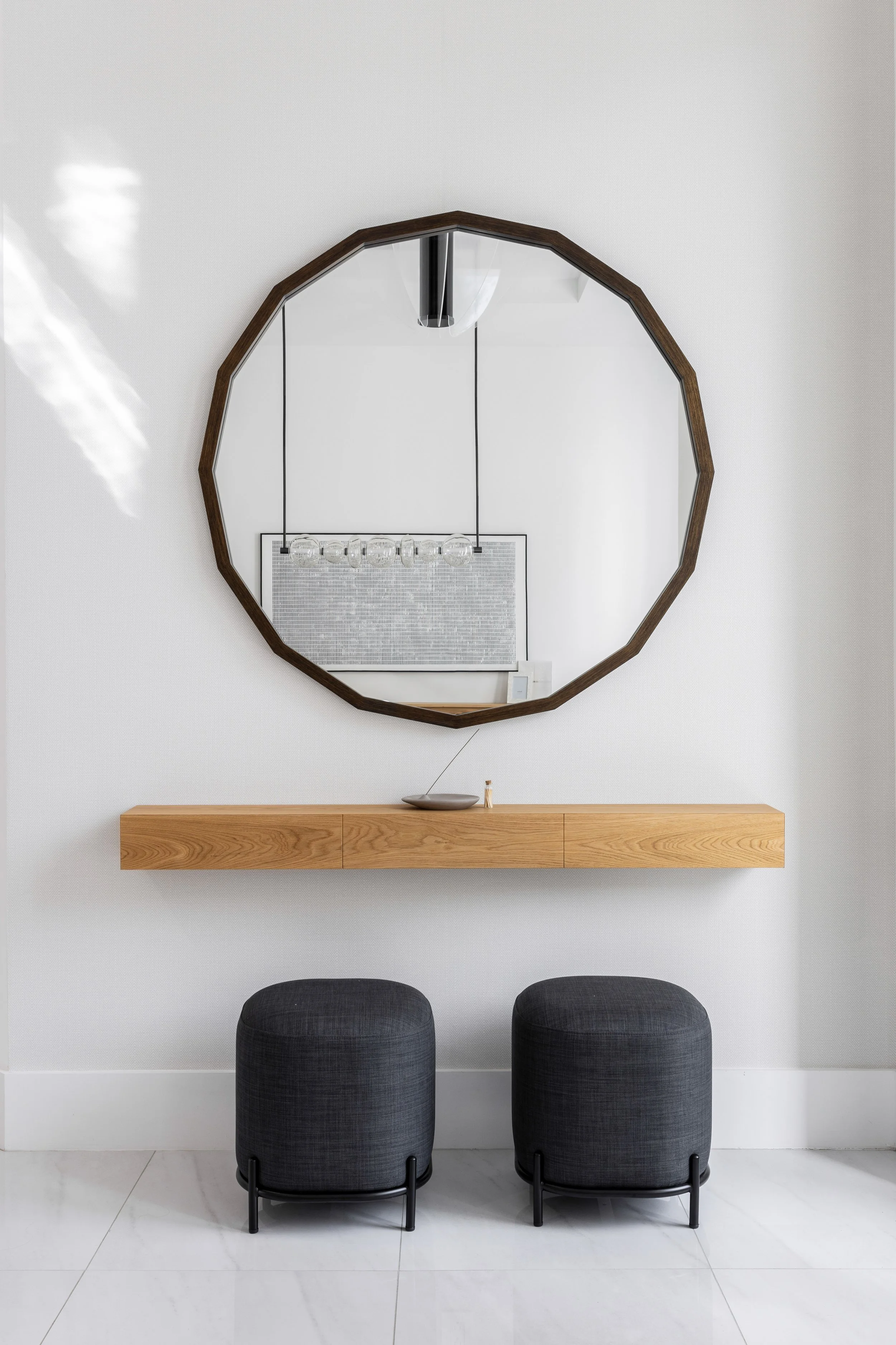 Entryway with circle mirror and storage space - Modern Family Estate - Pinecrest - CURATED. Studio