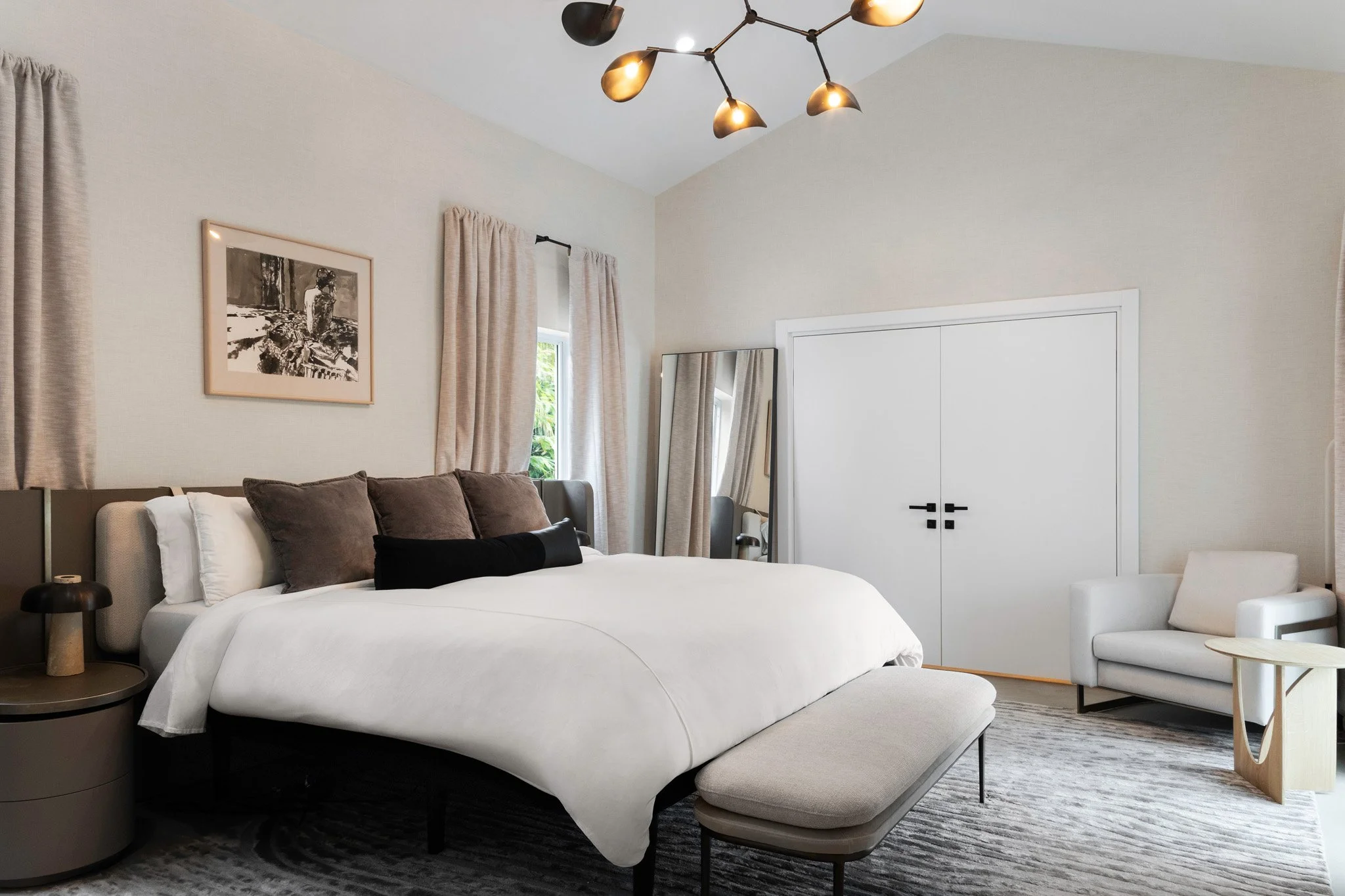 Modern bedroom with warm neutral wallpaper and dark accents - Modernized Brutalist Architecture - Coconut Grove - CURATED. Studio