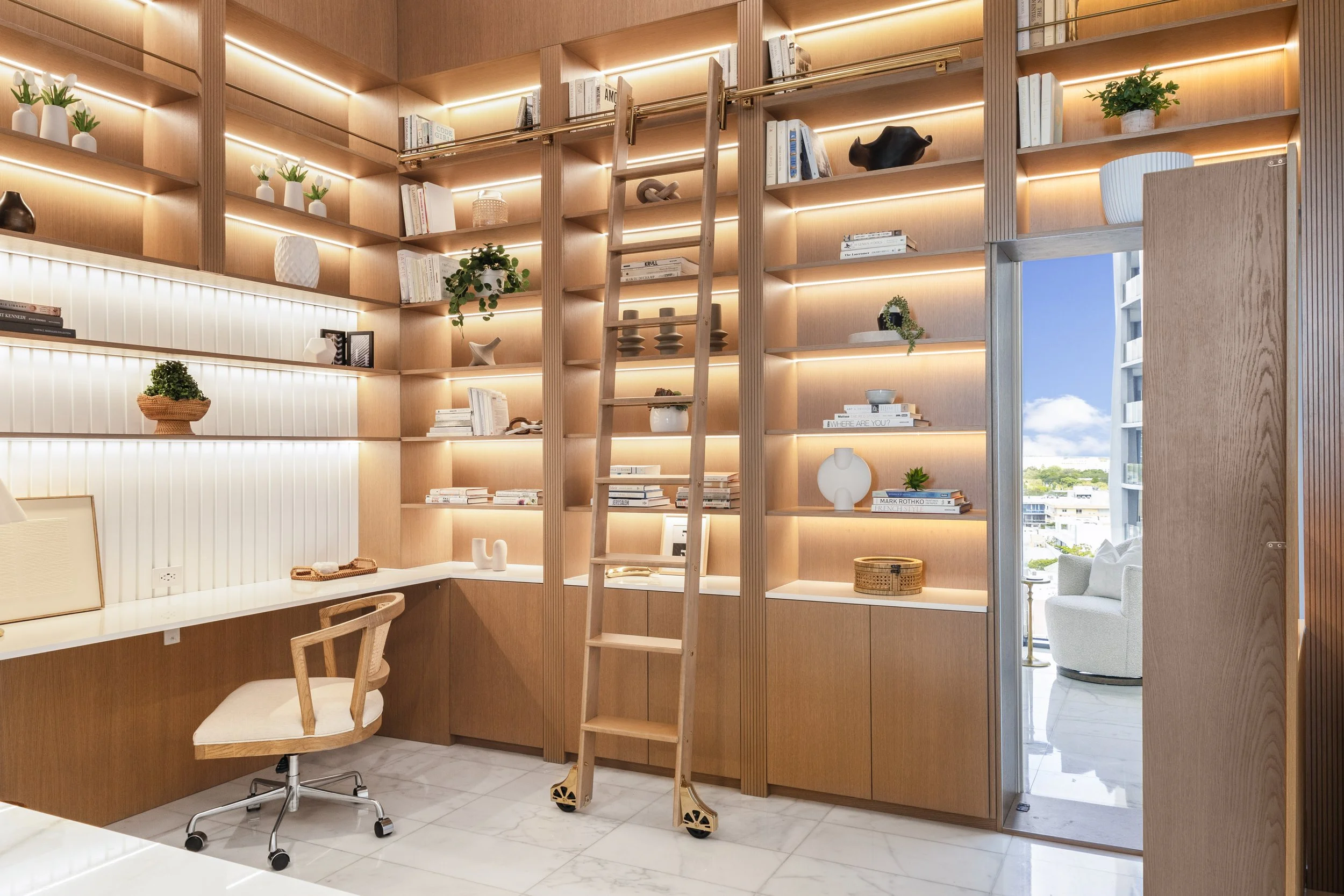 Home office with custom millwork bookshelf with hidden doorway - Two Park Grove - Parisian Inspired Design - CURATED. Studio