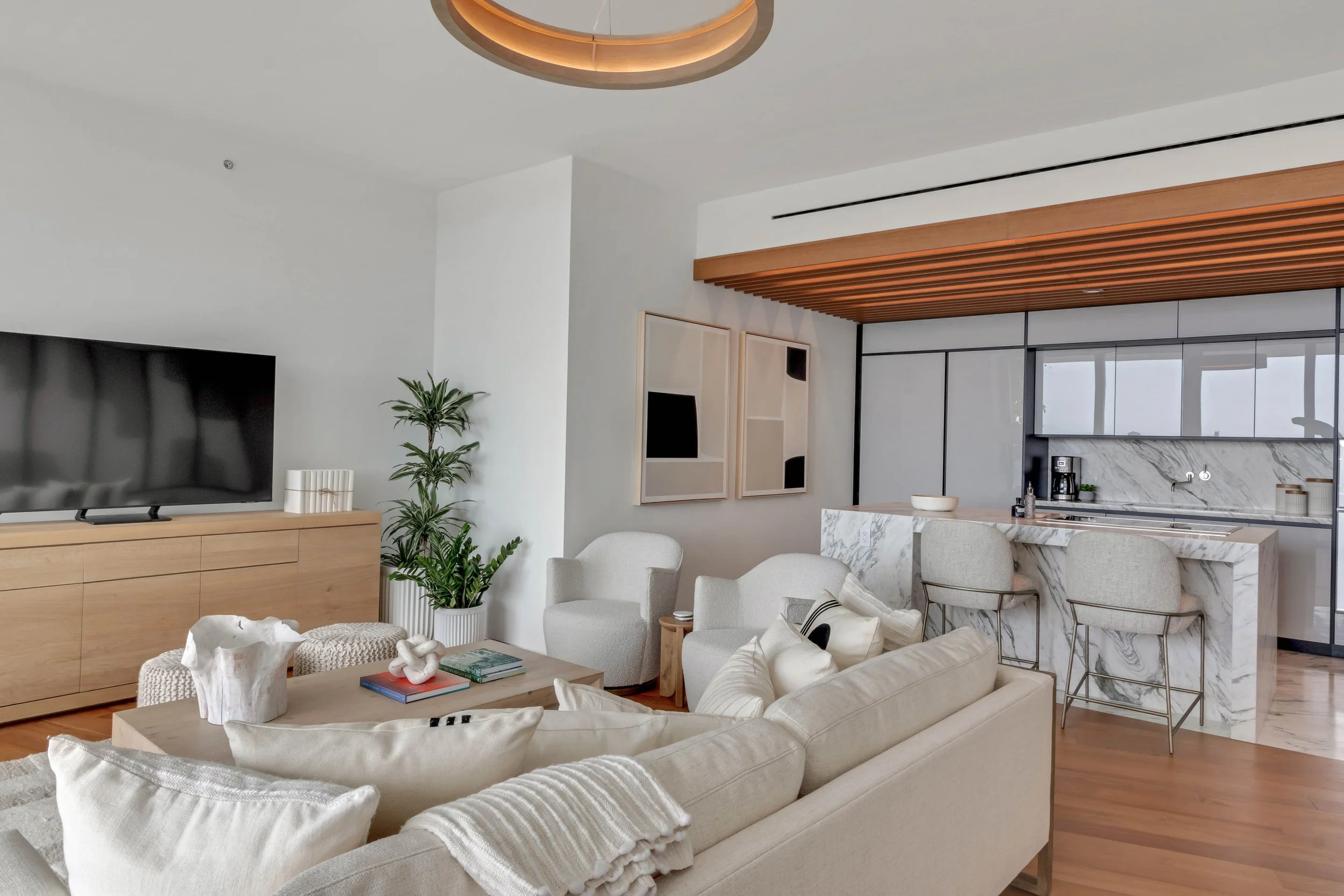 Contemporary open plan living space - Monad Terrace - "New Miami" Coastal Design - CURATED. Studio