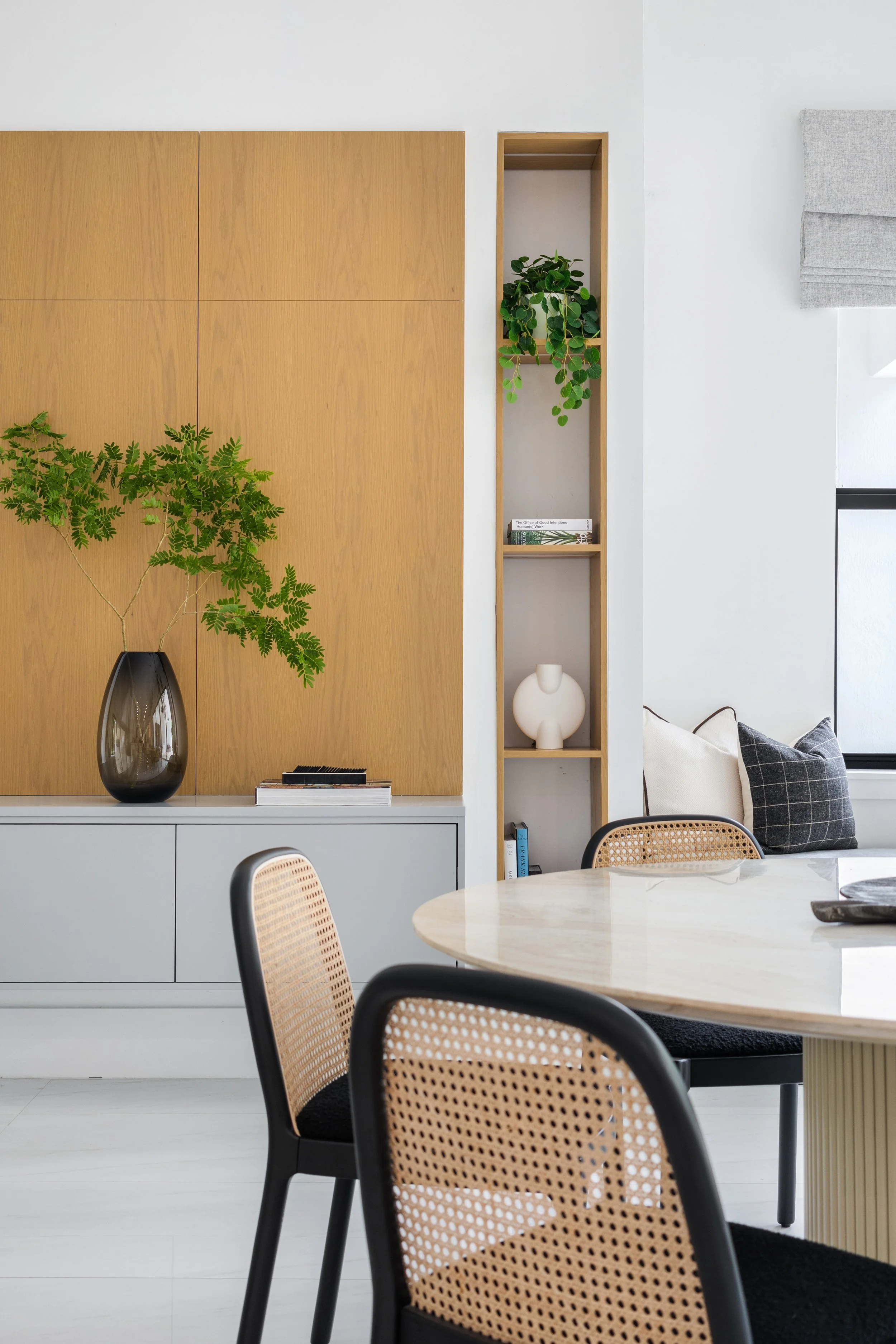Dining table with warm wood panels - Modern Family Estate - Pinecrest - CURATED. Studio