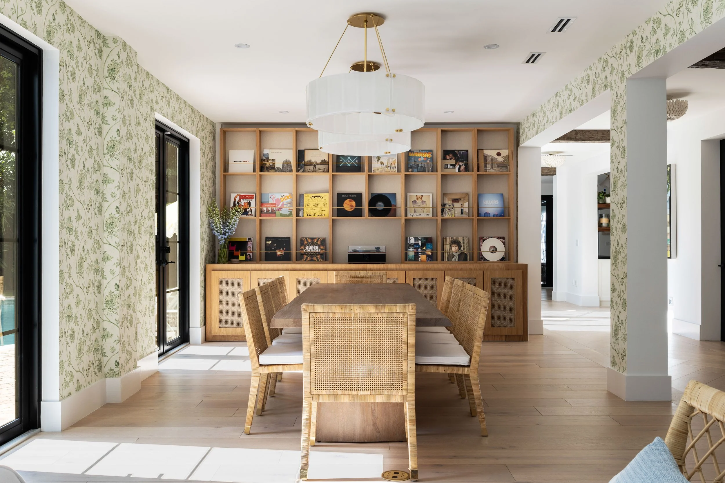 Dining space with custom record wall - Coastal Boho Estate - Coconut Grove - CURATED. Studio