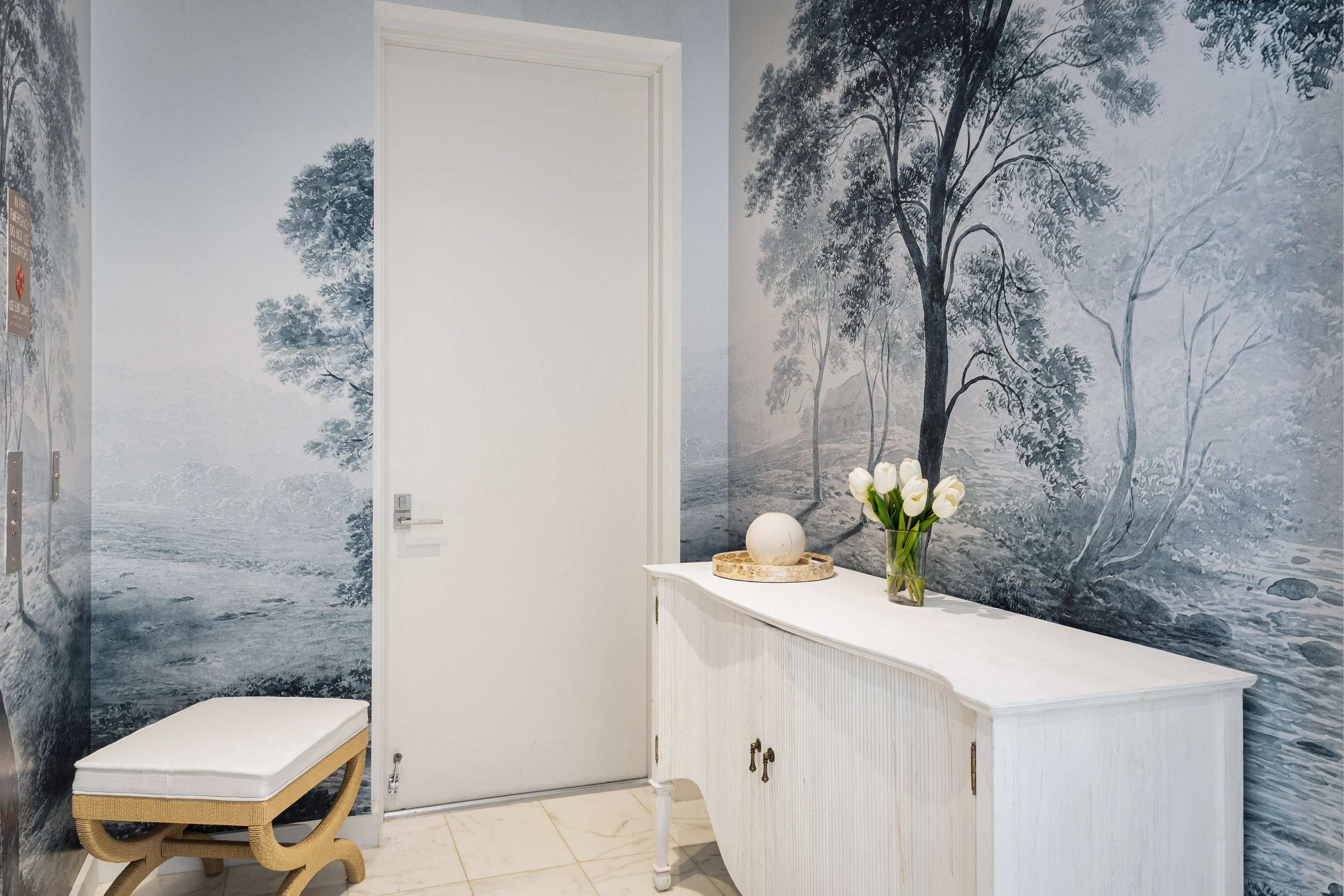 Entry space stepping out from elevator - Two Park Grove - Parisian Inspired Design - CURATED. Studio