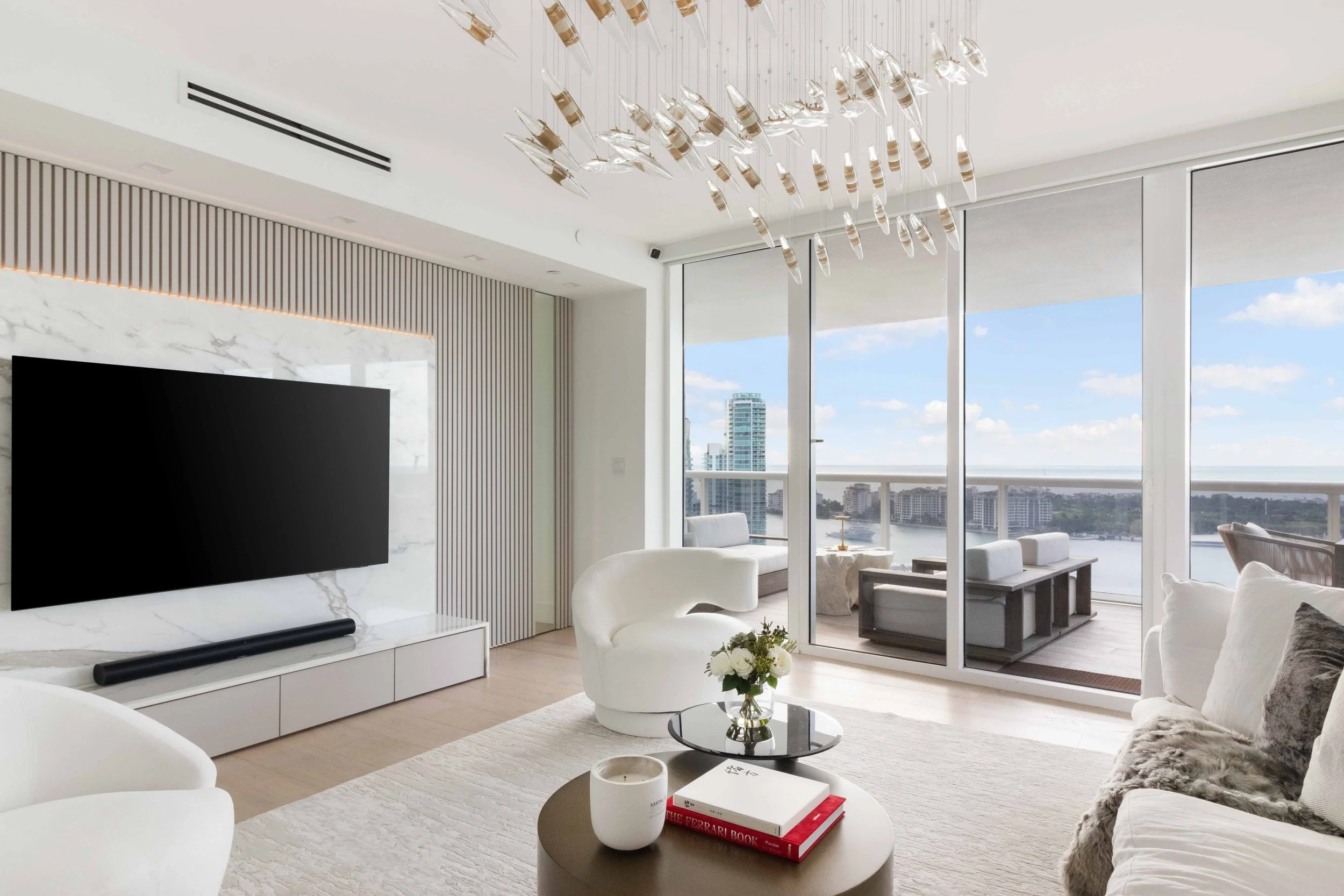 Modern living room with hidden doorway - Murano Grande - South of Fifth Design - CURATED. Studio