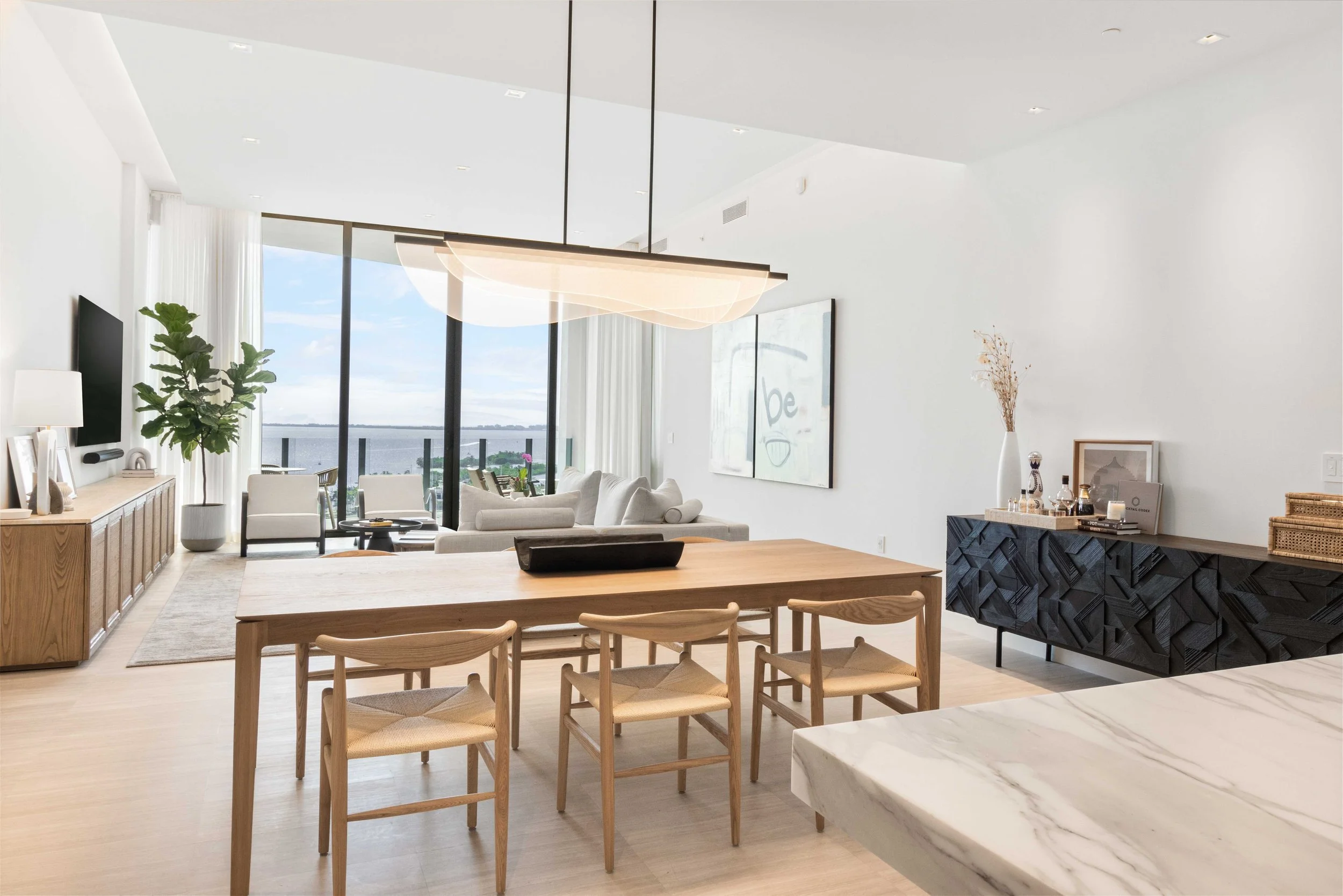 Modern open concept living and dining space - Park Grove Condo - Coastal Contemporary Design - CURATED. Studio