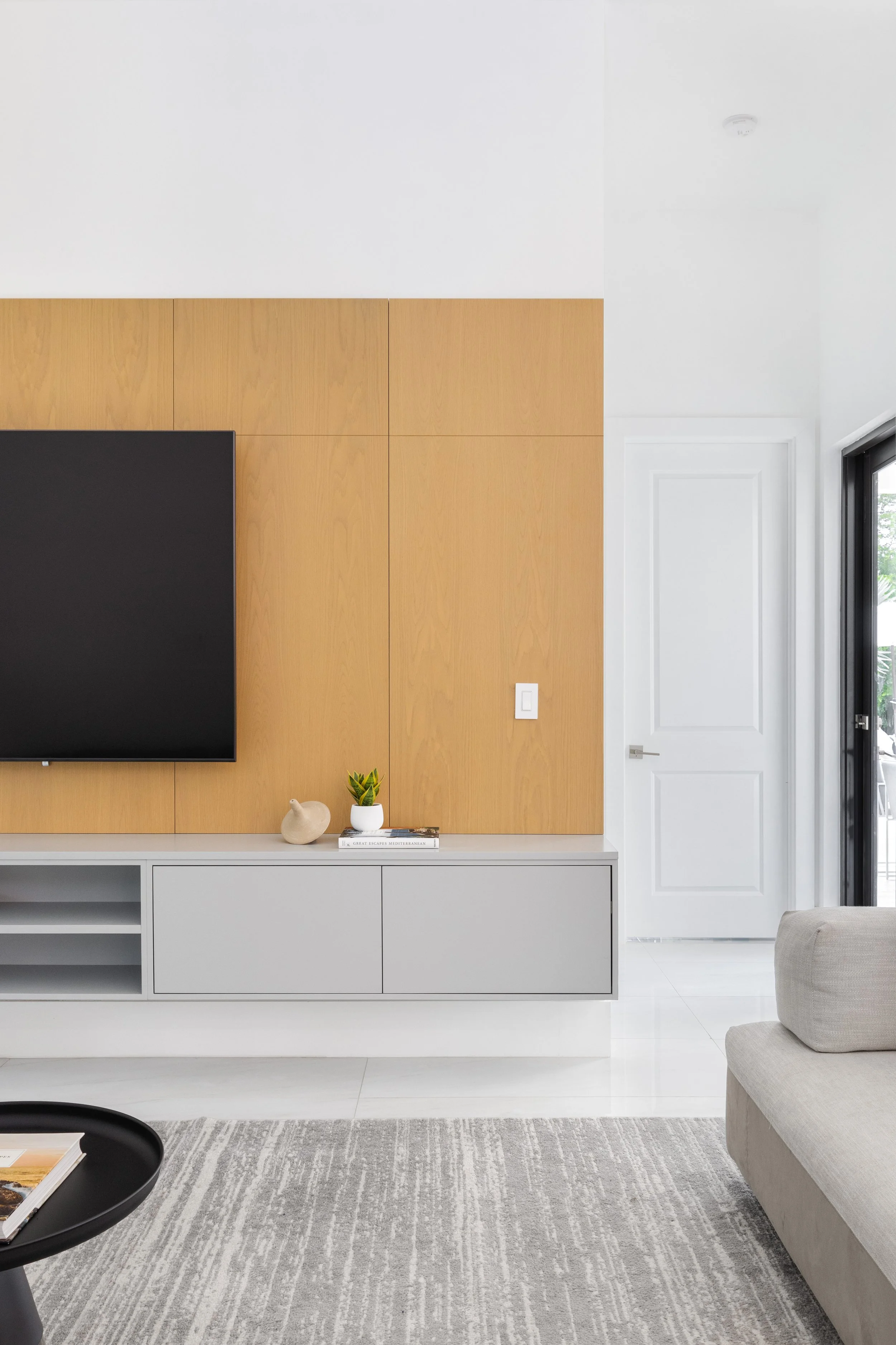 Detail shot of family room  with warm wood paneling - Modern Family Estate - Pinecrest - CURATED. Studio