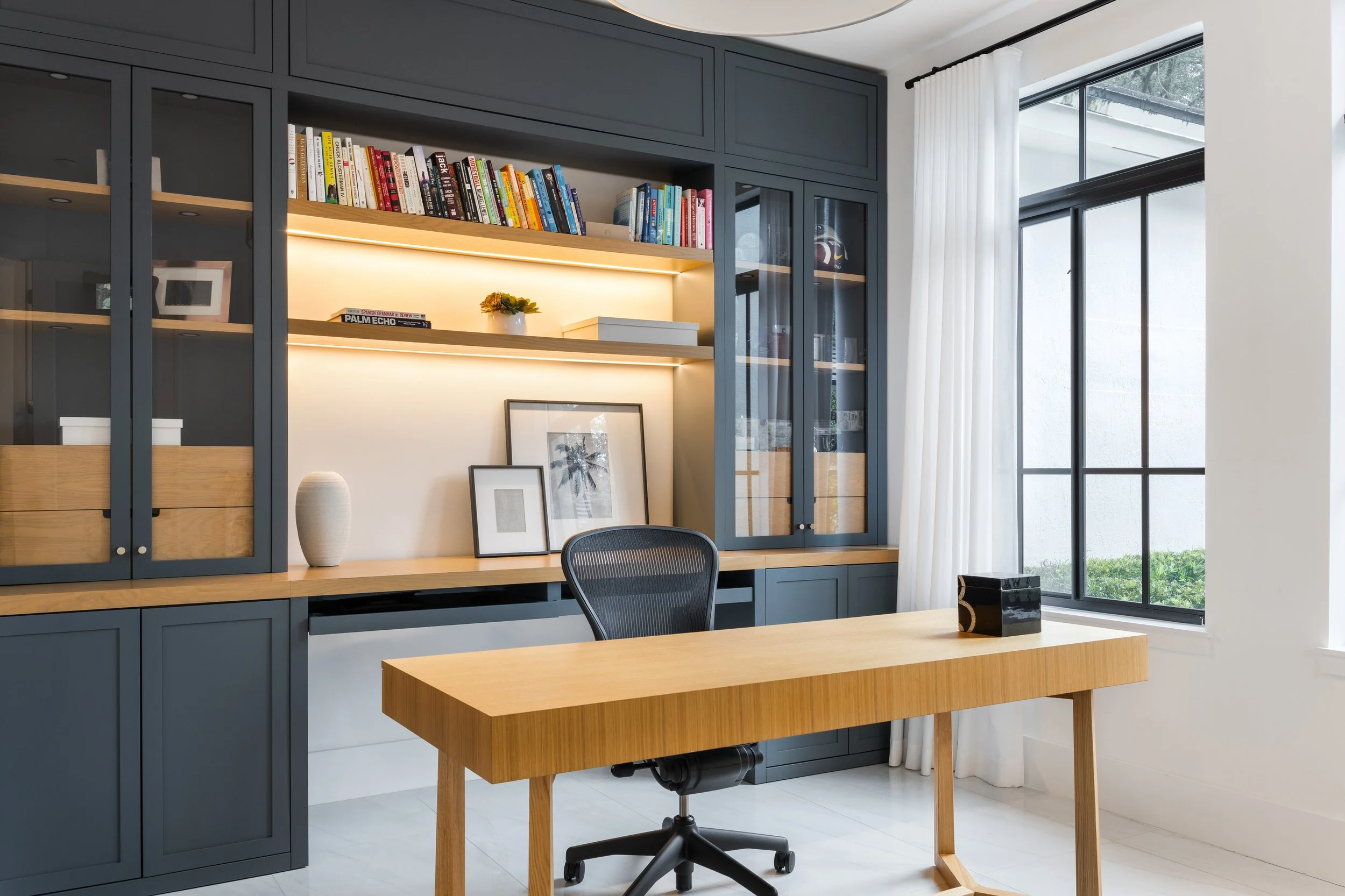 A modern home office with darker accent built ins - Modern Family Estate - Pinecrest - CURATED. Studio