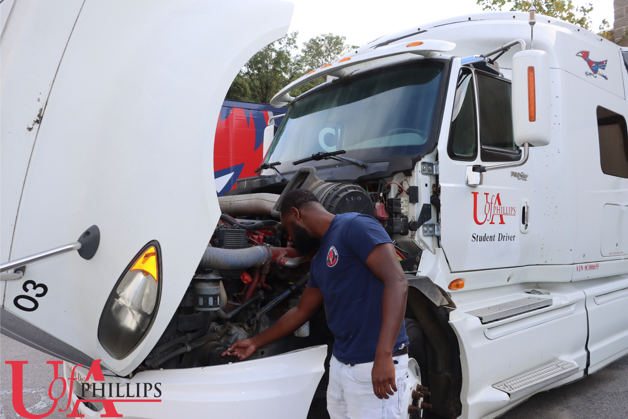 A PCCUA CDL student checking the engine on a 18 Wheeler