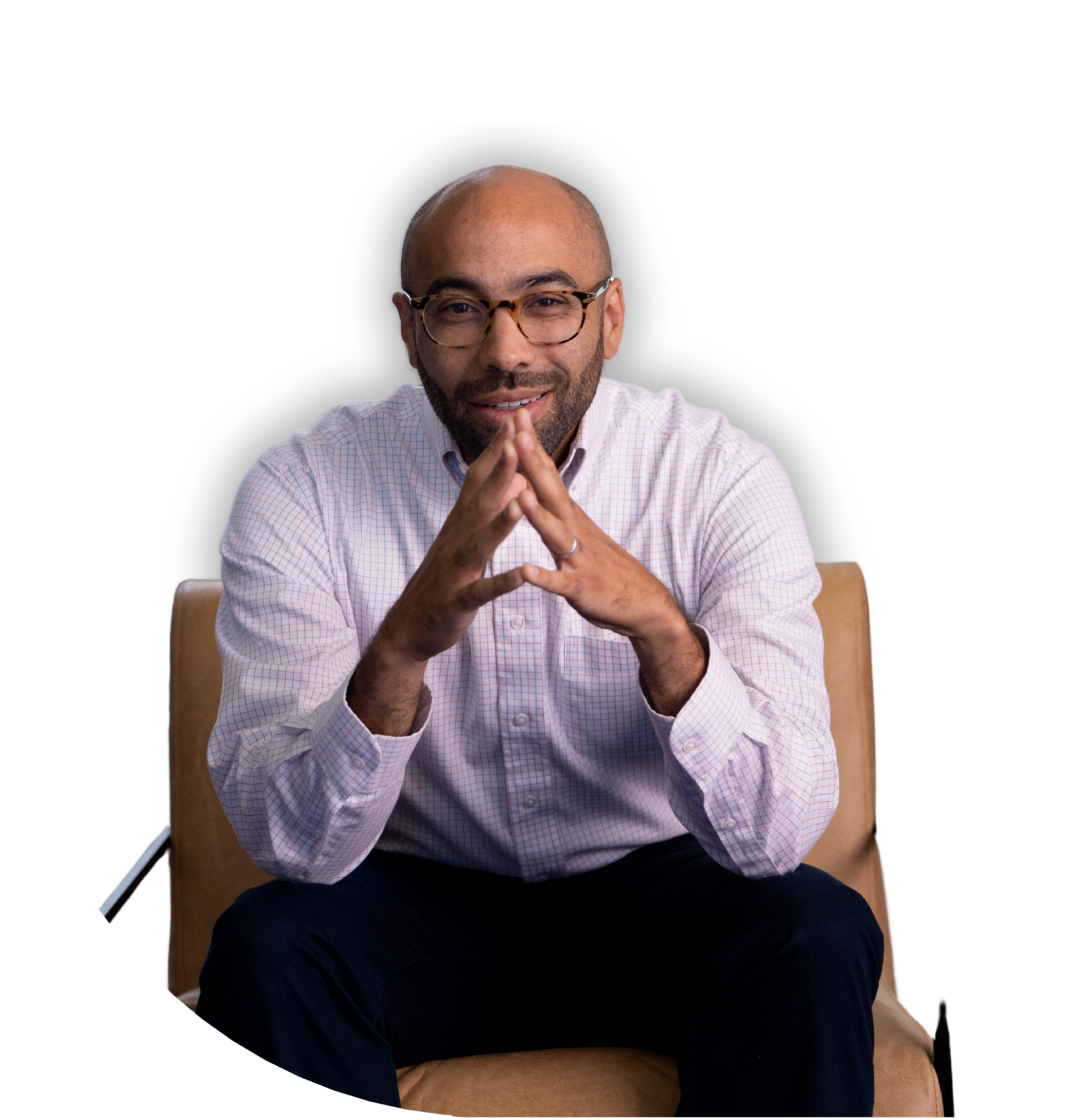 A man with glasses and a beard sitting on a tan chair  | Dr Matthew Breuninger | Therapist, Catholic Speaker, Course Creator, and Author | Steubenville, OH