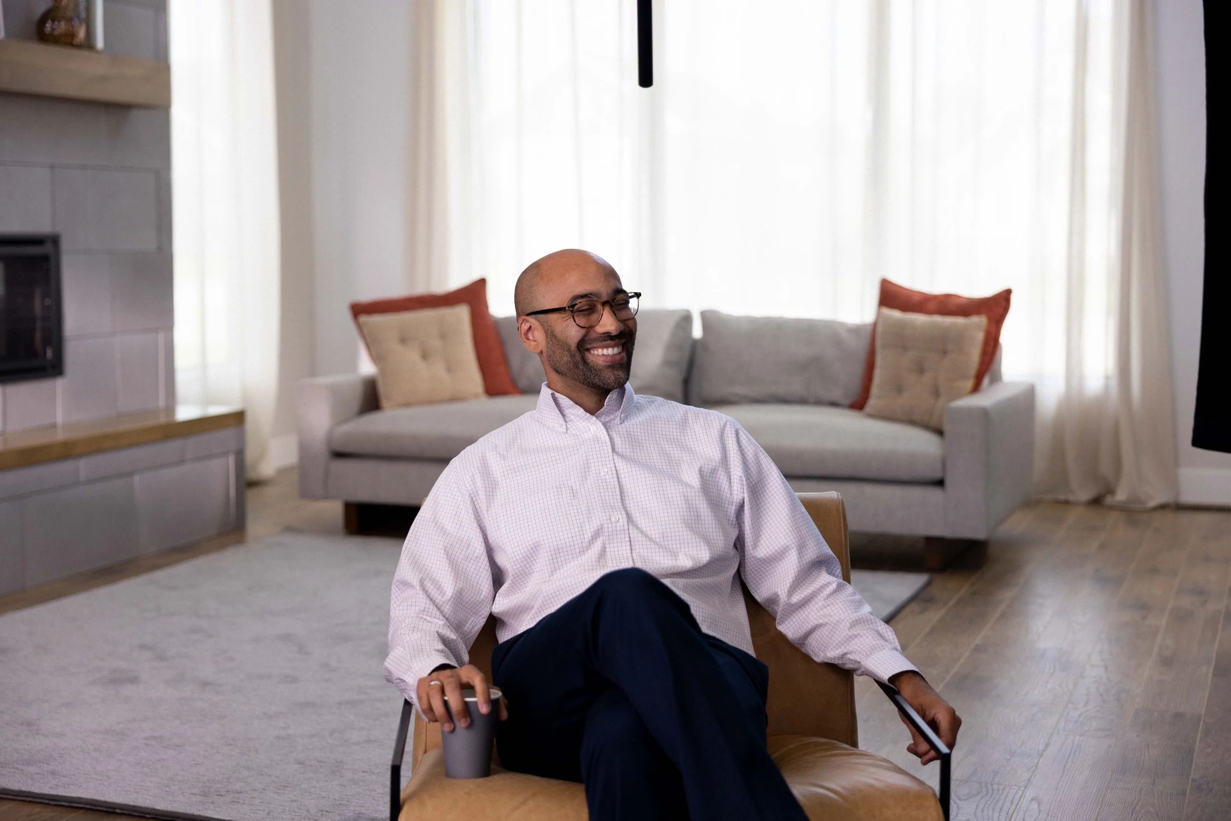 A man sitting comfortably in a living room  | Dr Matthew Breuninger | Therapist, Catholic Speaker, Course Creator, and Author | Steubenville, OH