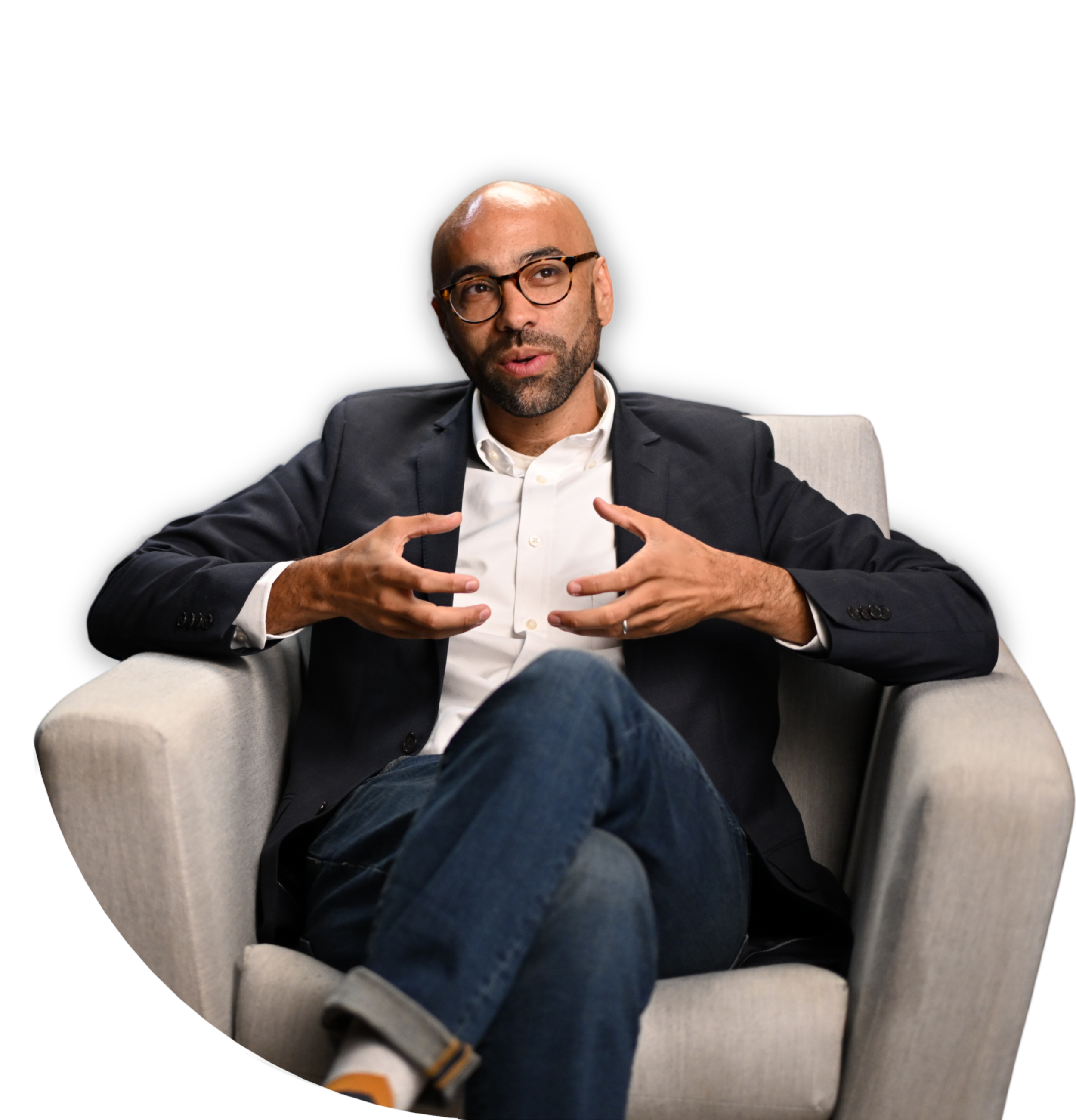 Man sitting in a beige armchair, wearing glasses, during therapy  | Dr Matthew Breuninger | Therapist, Catholic Speaker, Course Creator, and Author | Steubenville, OH