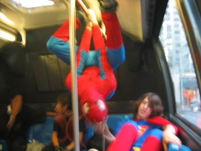 Spider man and super man on the bus