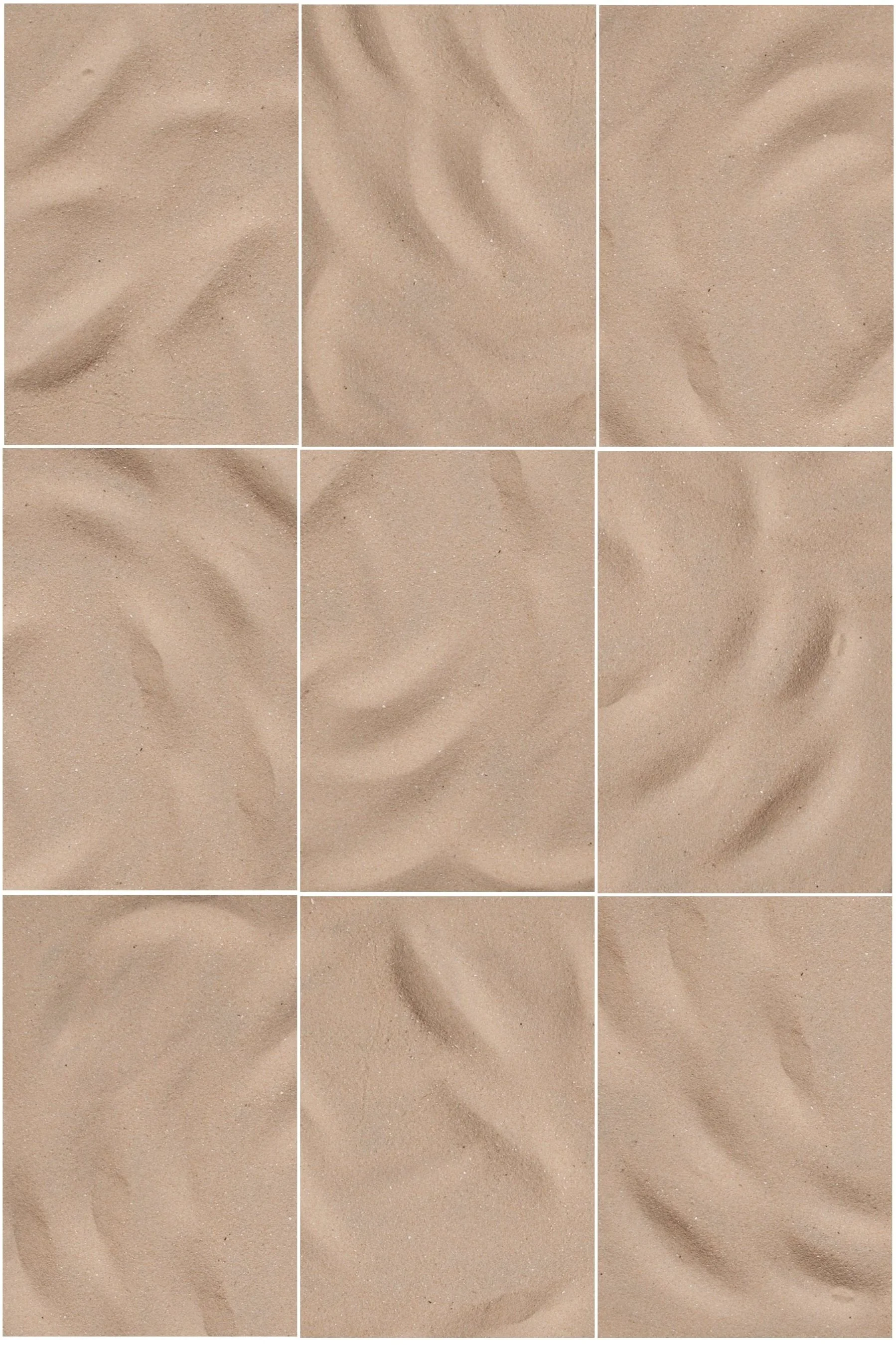 Close-up of light brown sand with small ripples and grains.