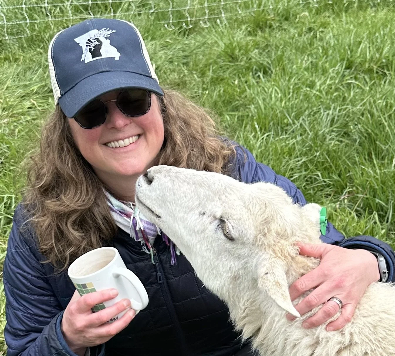 Photo of Jill Lucht, Conservation Coordinator, and a Goat