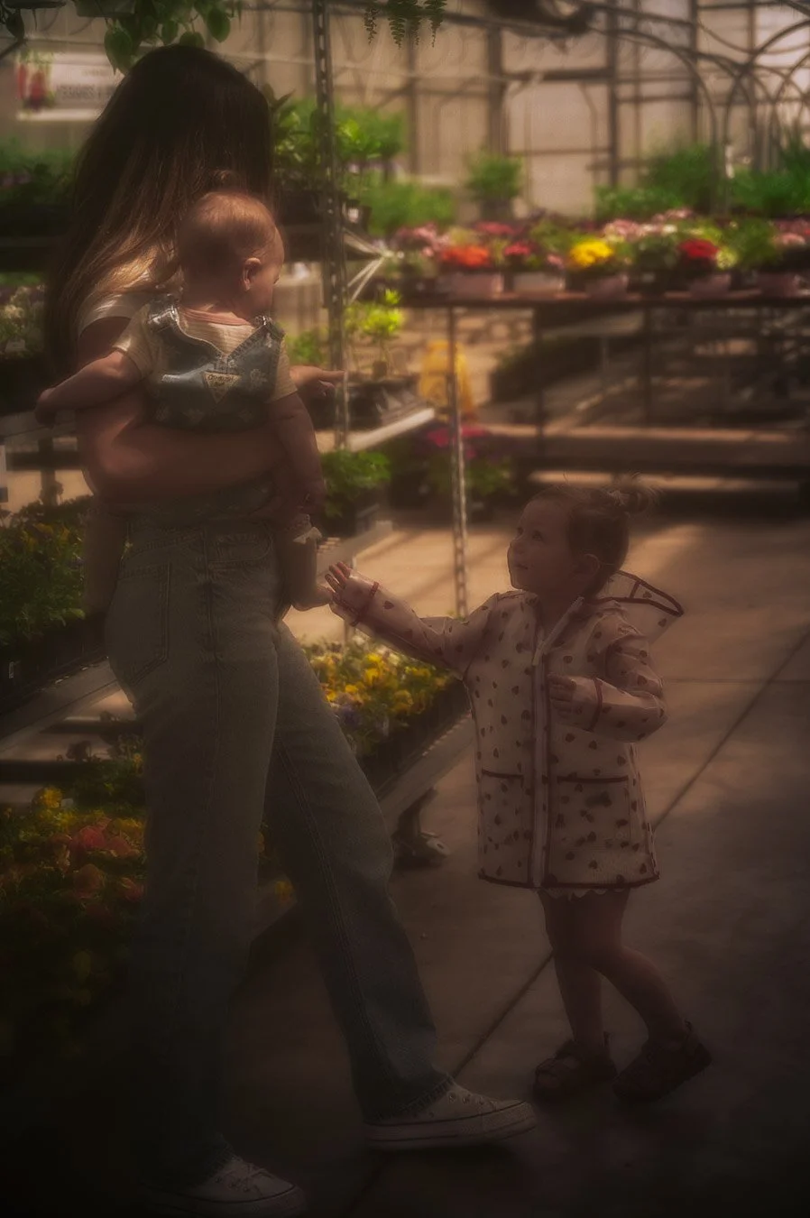 Mother with multiple children smiling during family Mother’s Day mini session