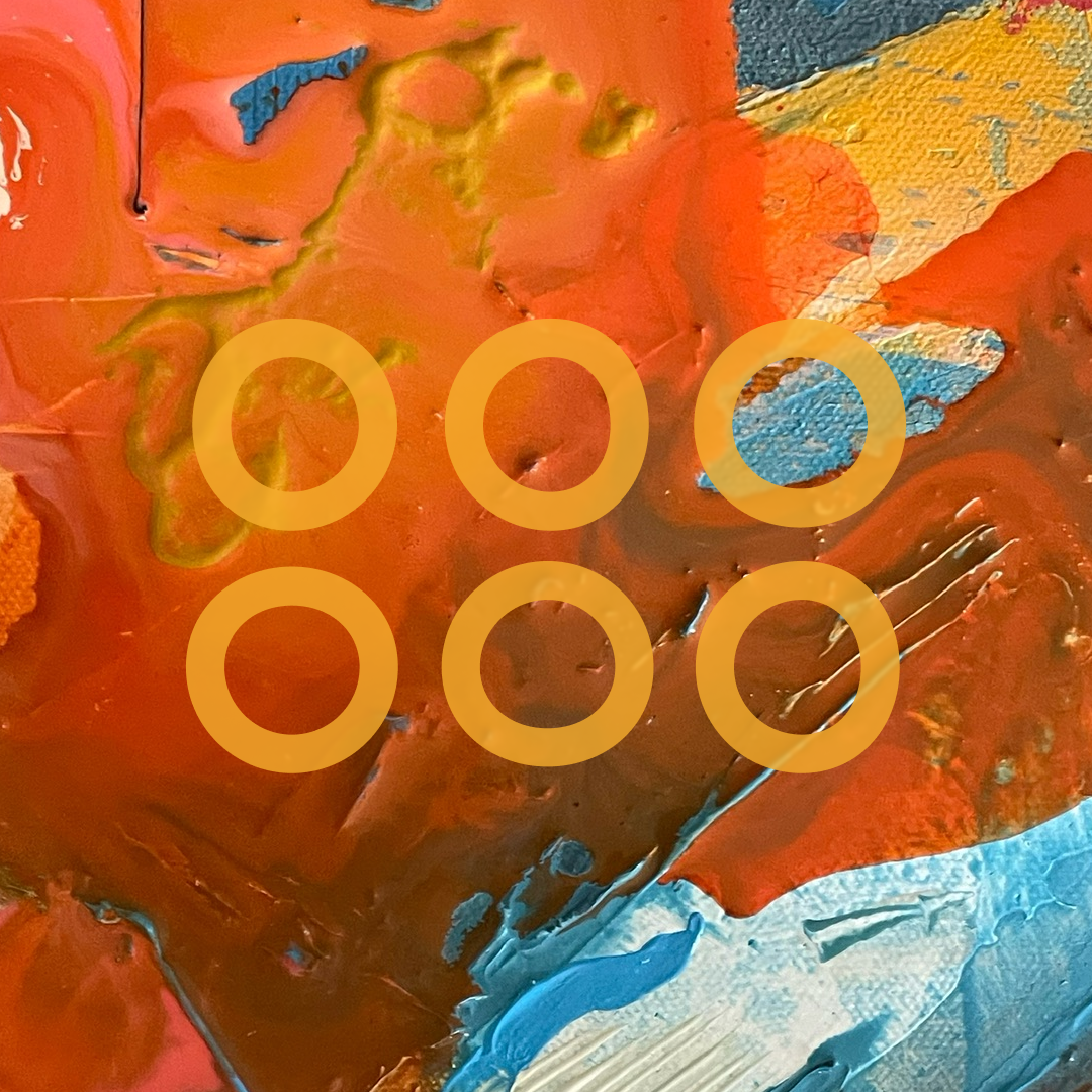 Close-up of an abstract painting with prominent orange, red, blue, and yellow colors and circular patterns.