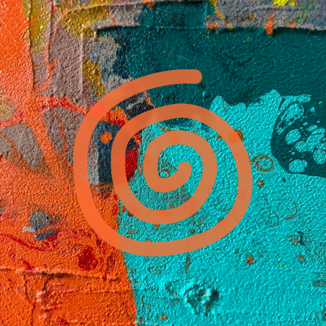 Close-up of a colorful, textured wall with orange, blue, and black spray paint splatters and drips, overlaid with a Reiki spiral.