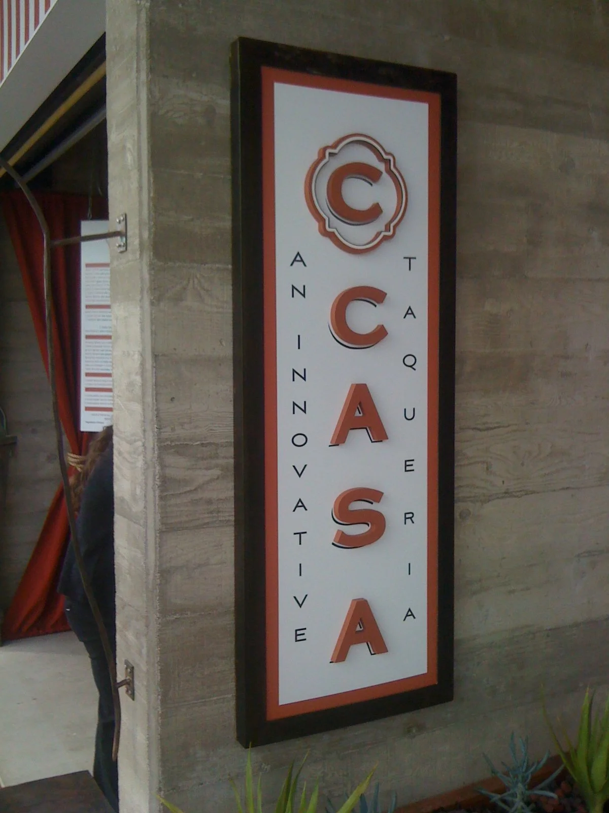Custom vertical blade signage for CASA enhancing street visibility and customer wayfinding